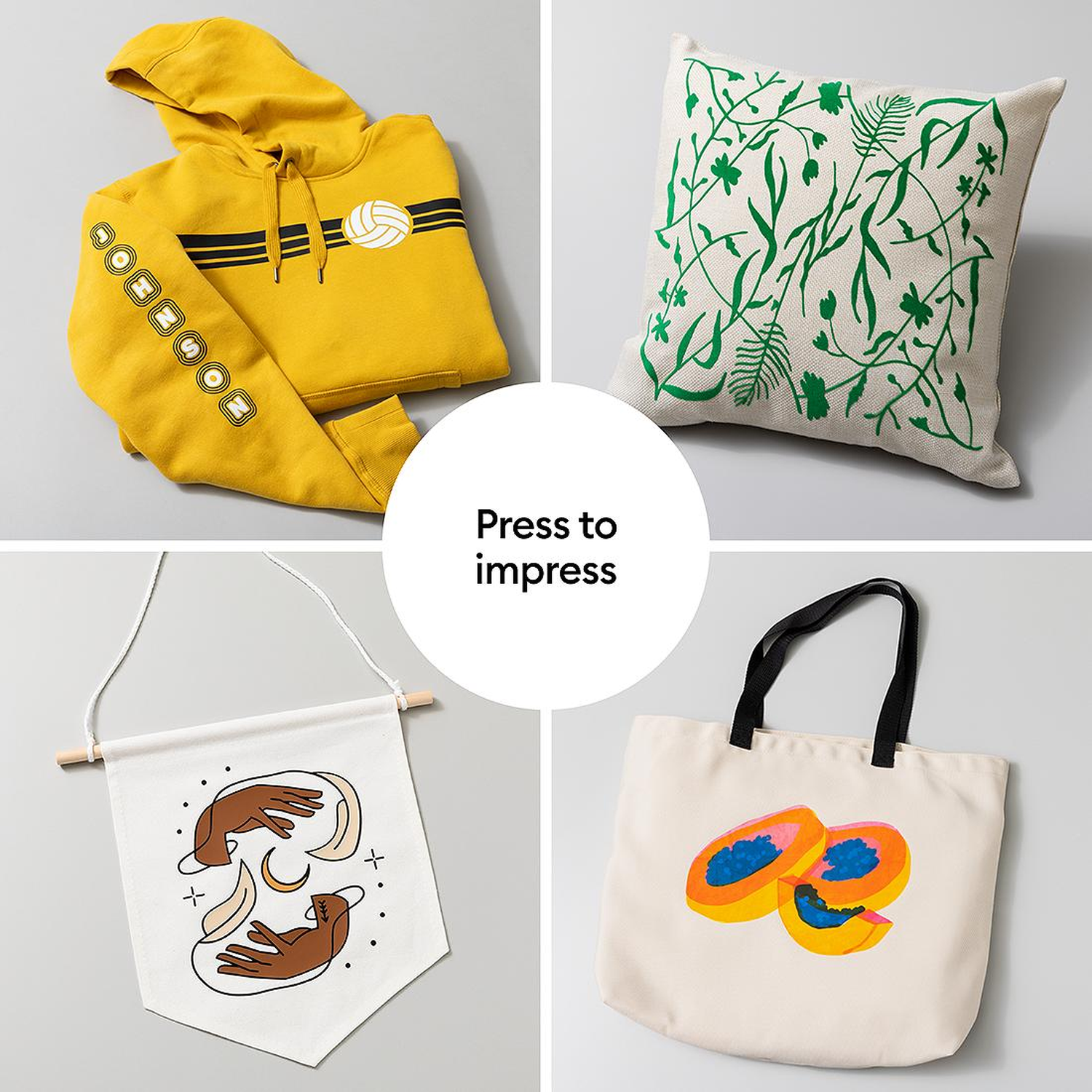 Yellow hoodie, green pillow, fabric banner, and tote bag with papayas.