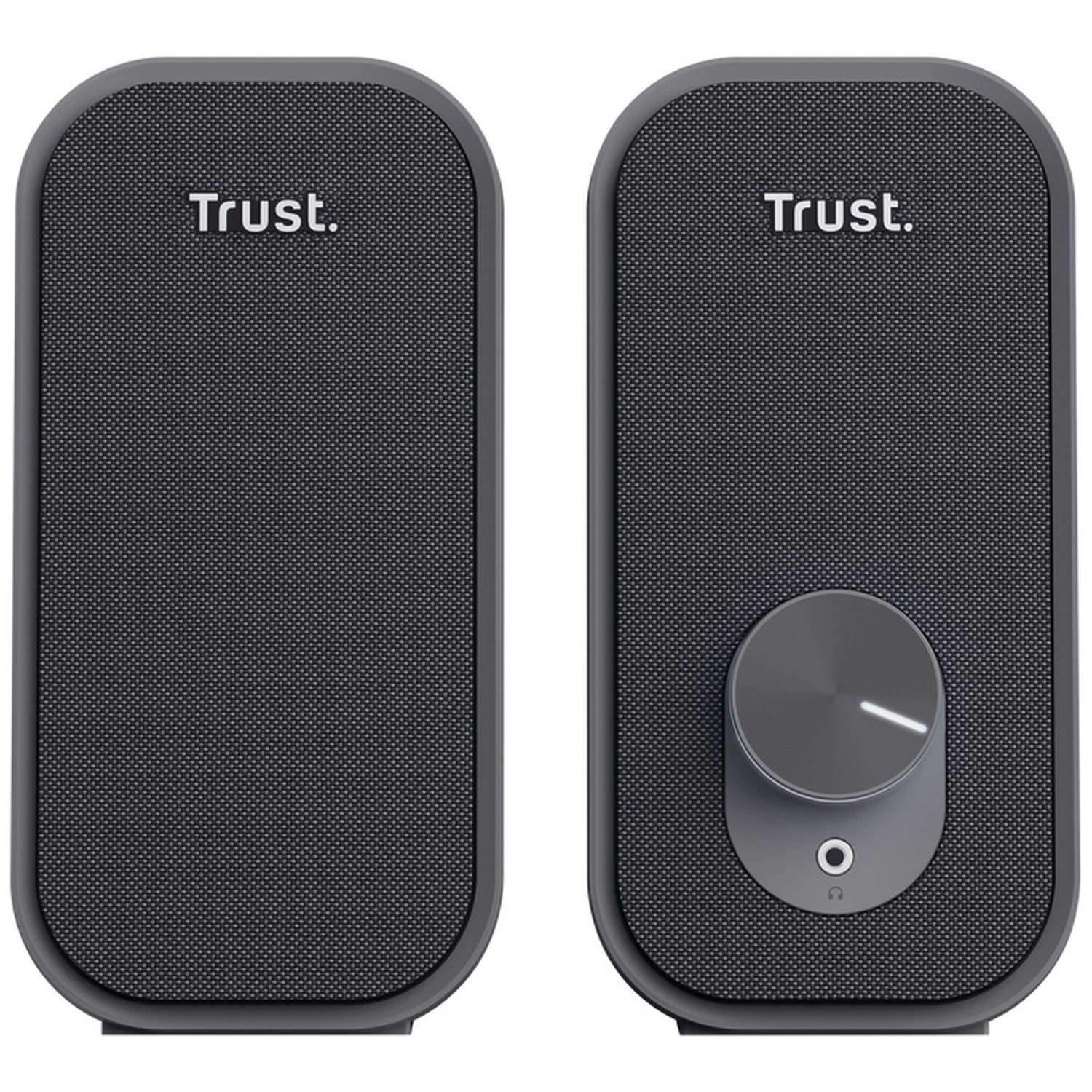 Two black Trust speakers side-by-side. One has a volume knob and headphone jack.