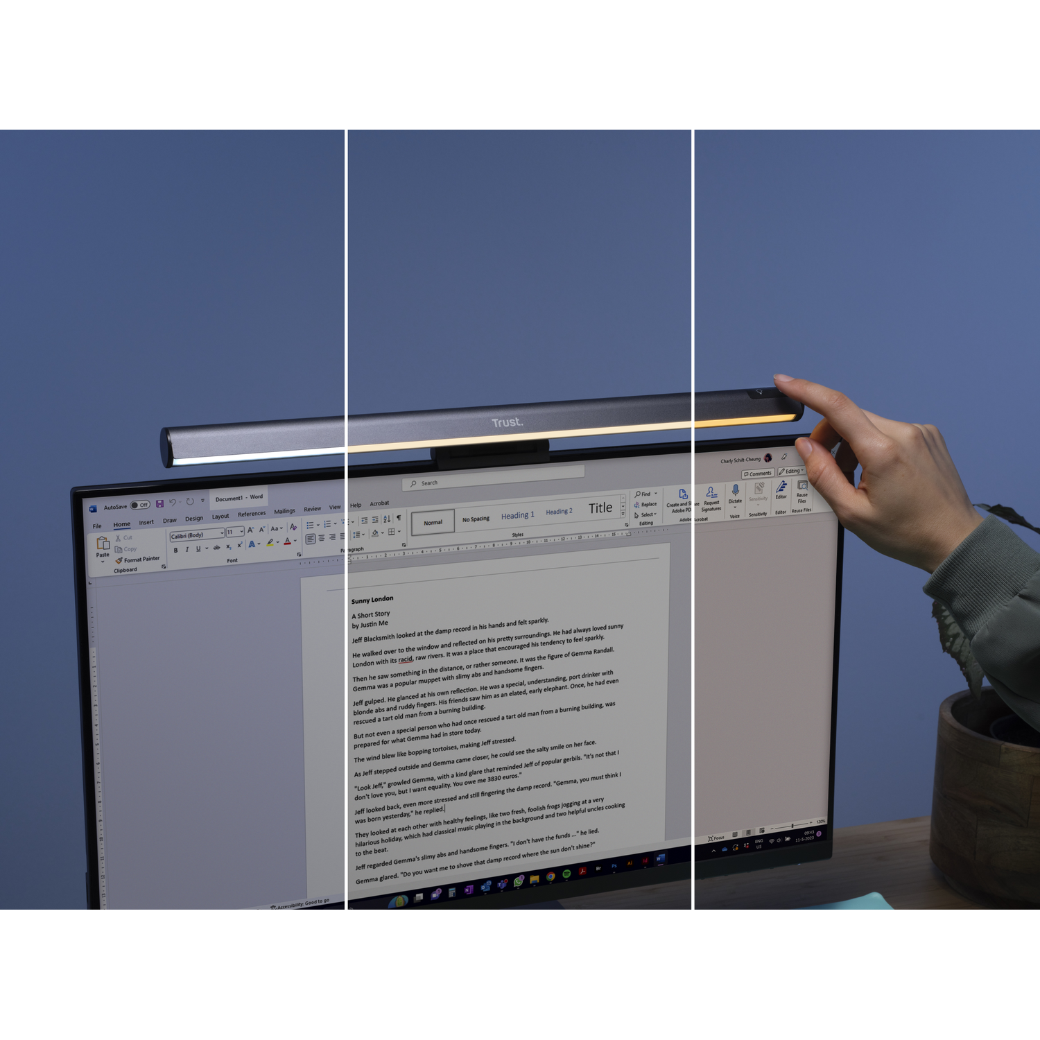 A book on a computer monitor with a desk lamp in the foreground.
