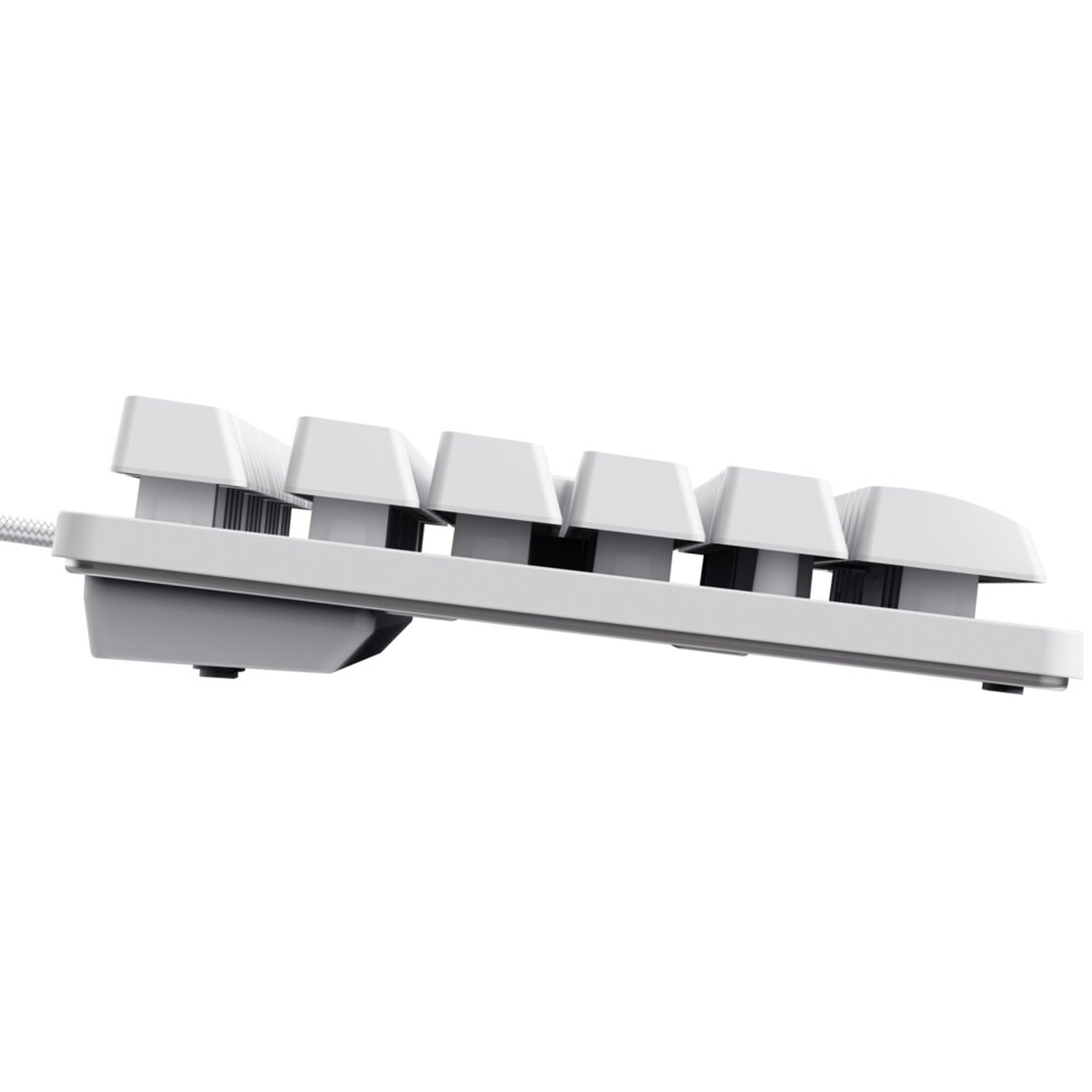 Close-up side view of a white keyboard with visible keys.
