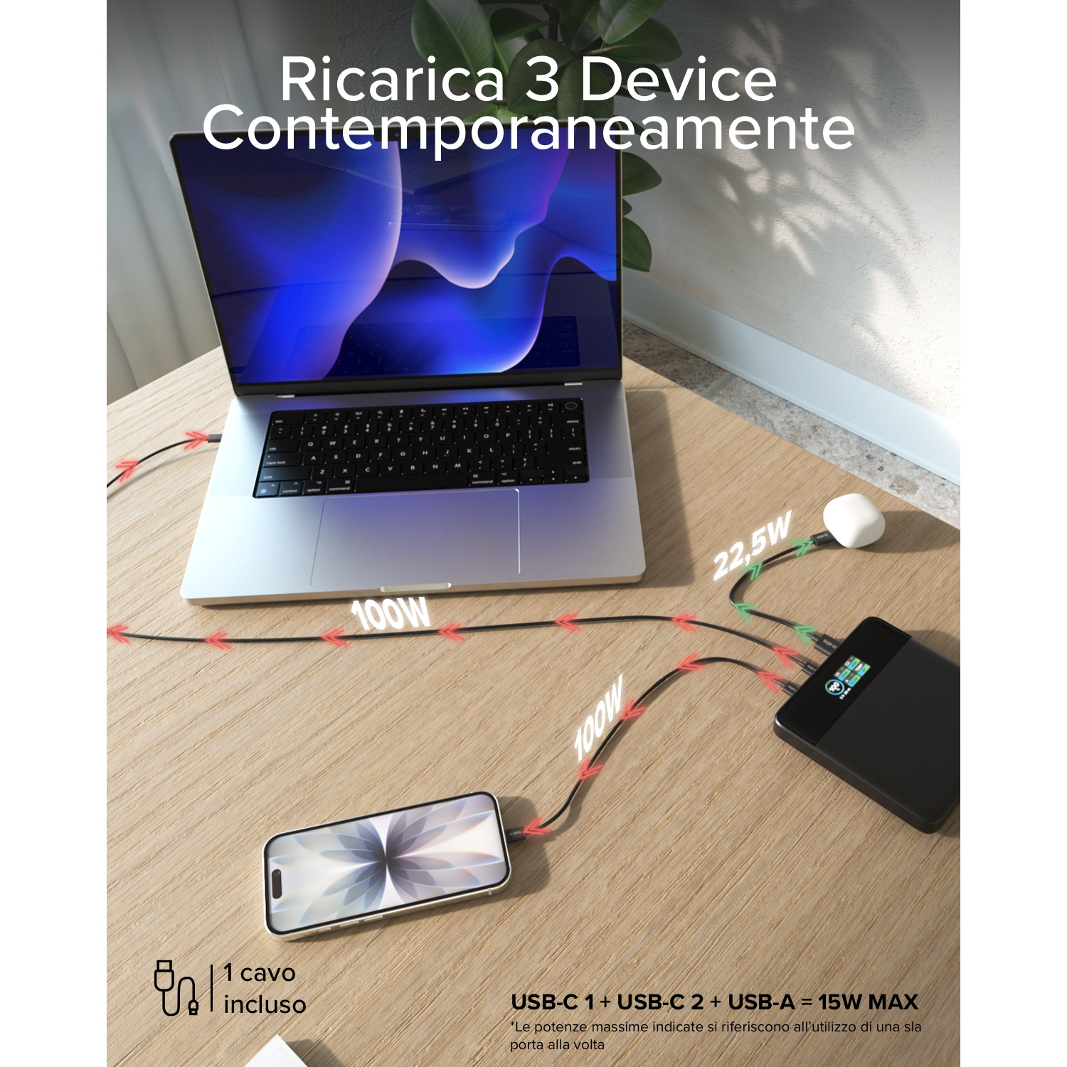 Un laptop, uno smartphone e auricolari si caricano contemporaneamente.