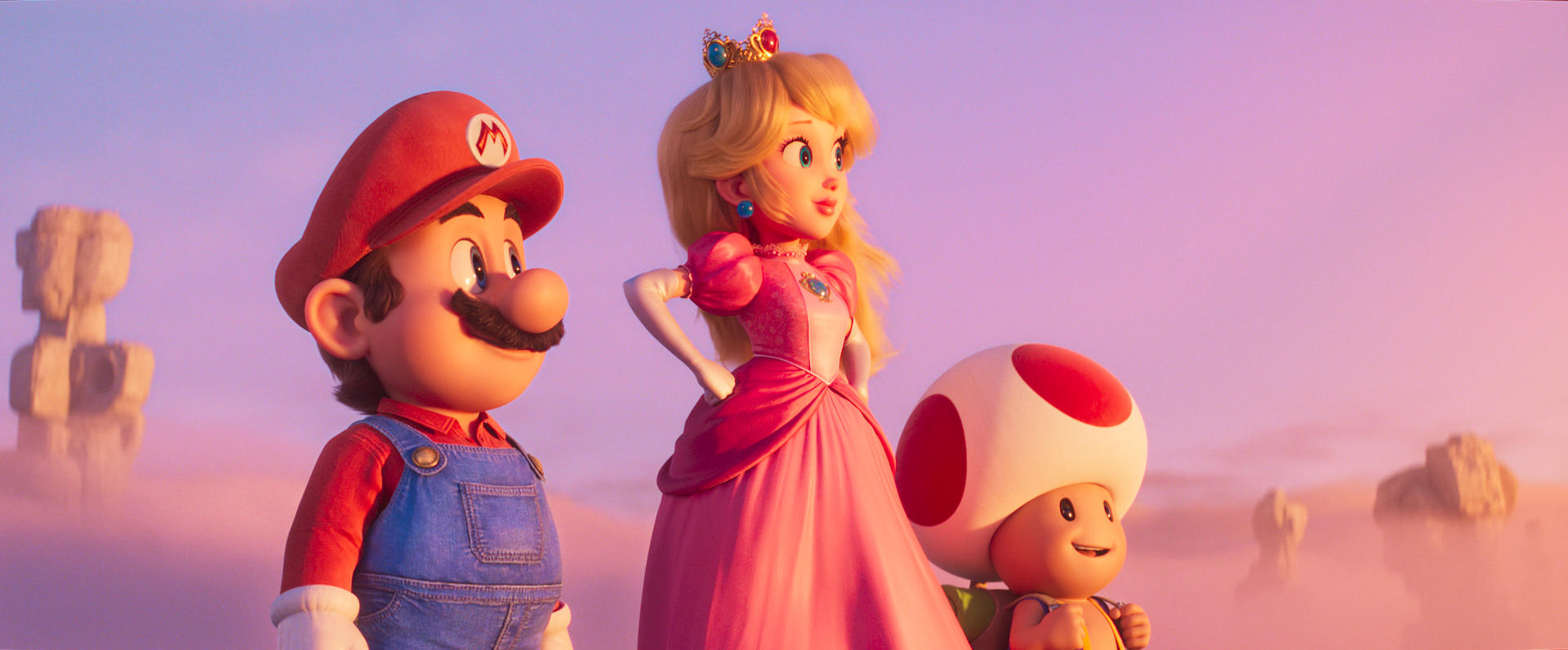Mario, Prinzessin Peach und Toad stehen vor einer rosa-violetten Himmelskulisse.