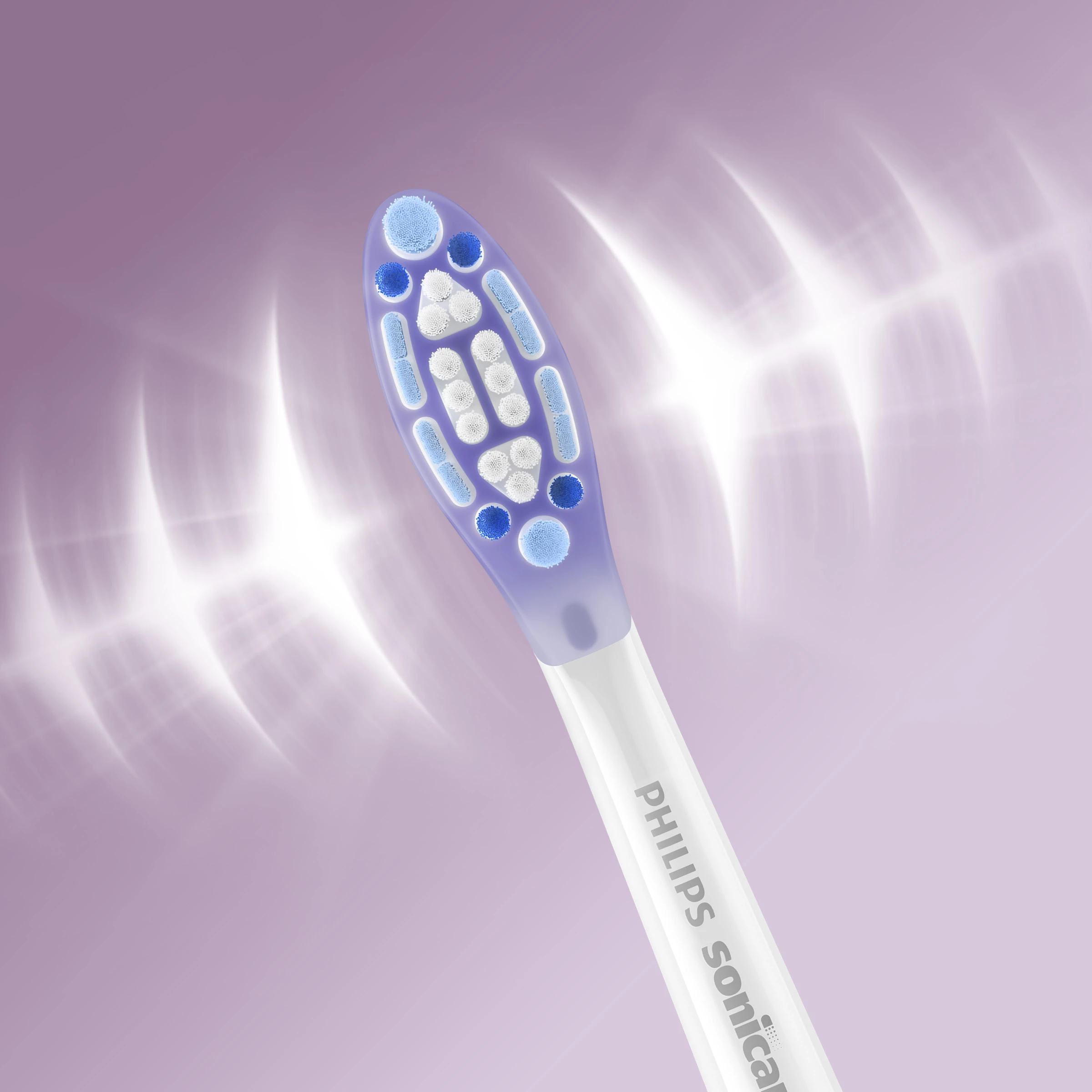 Zbliżenie główki szczoteczki elektrycznej z niebieskim i białym włosiem na fioletowym tle.