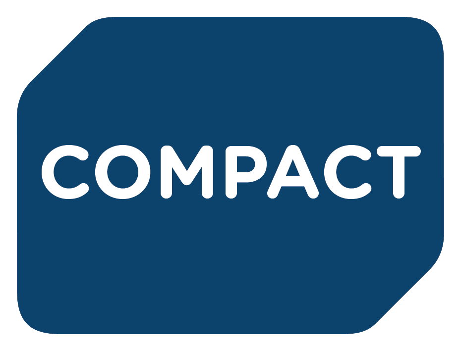 Napis COMPACT białymi literami na ciemnoniebieskim tle.