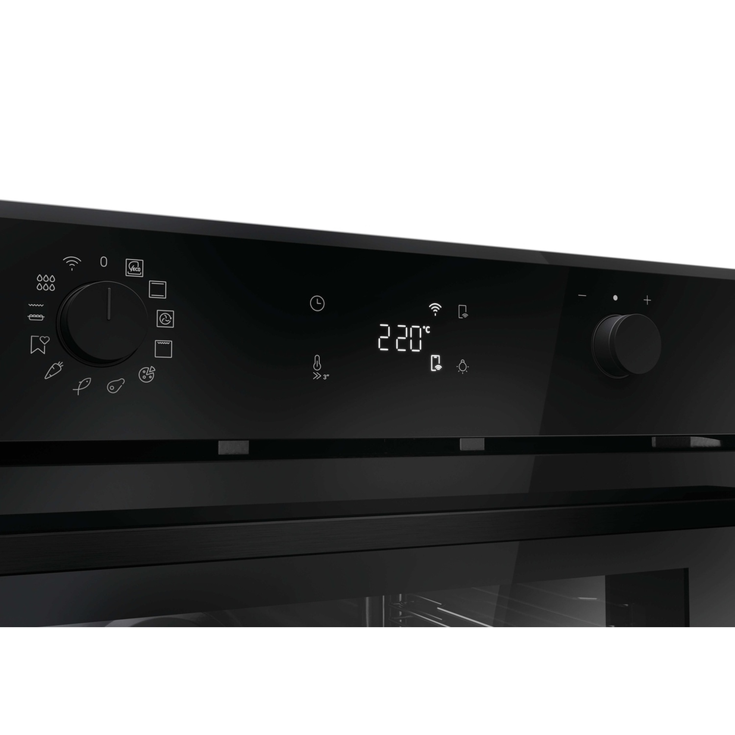 Primo piano di un display da forno nero che mostra 220°C e manopole con icone.