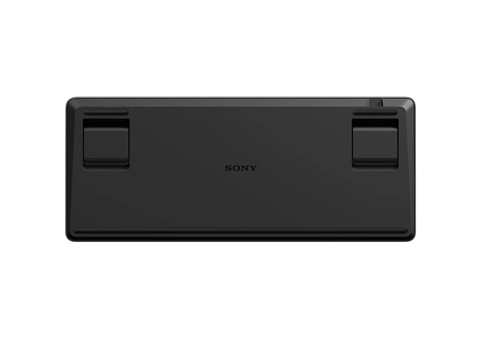 Spód czarnej klawiatury Sony z rozkładanymi nóżkami.