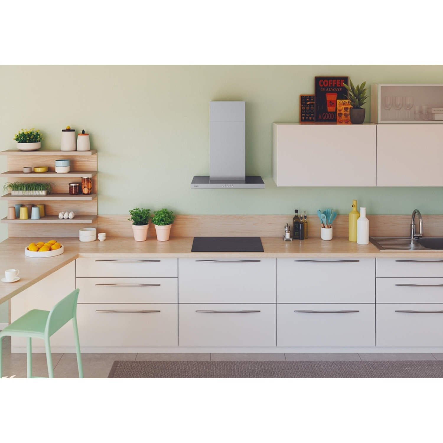 Cucina moderna con parete verde chiaro, bancone in legno, mobili bianchi e cappa.