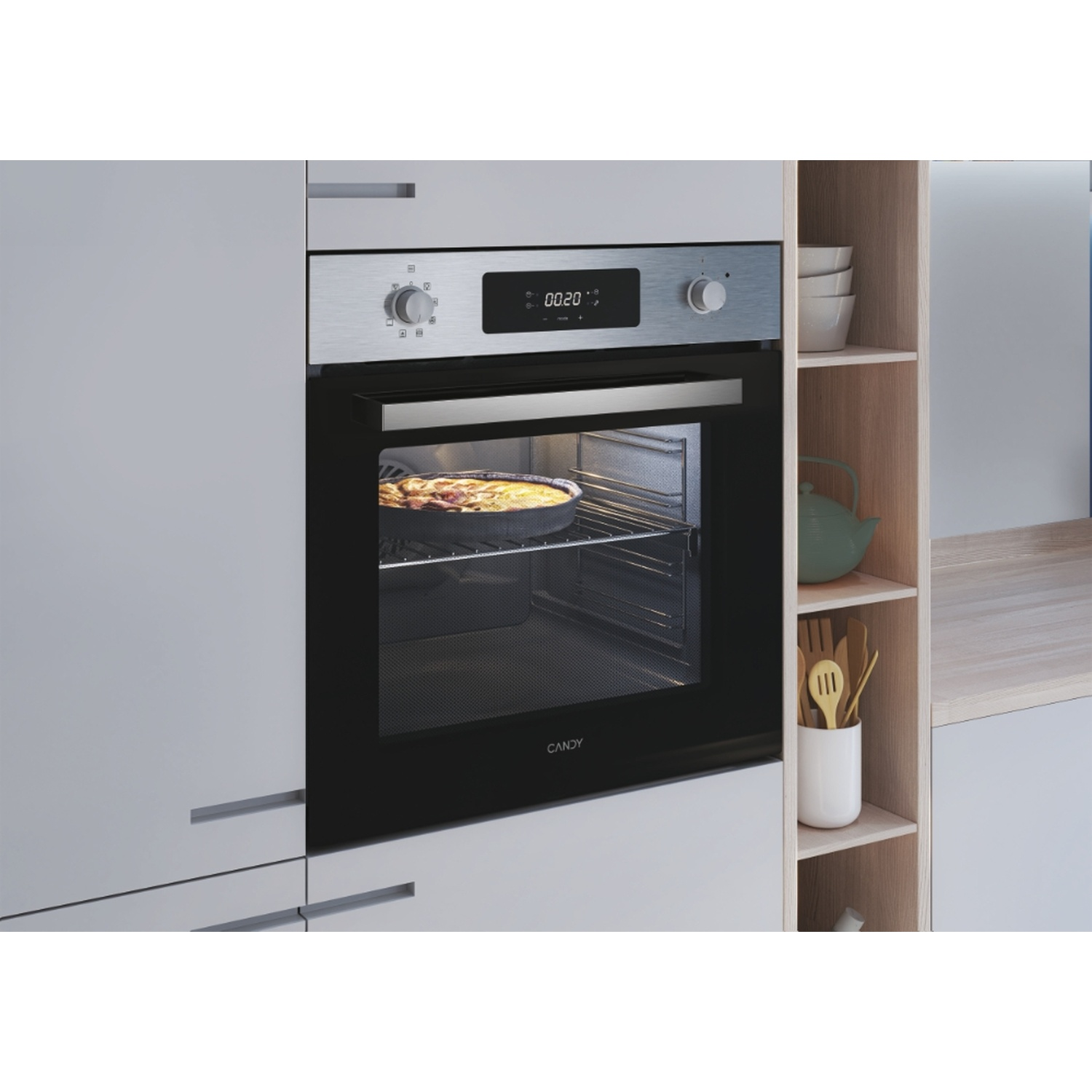 Un forno moderno con una teglia all'interno. Un display digitale mostra 00:20.