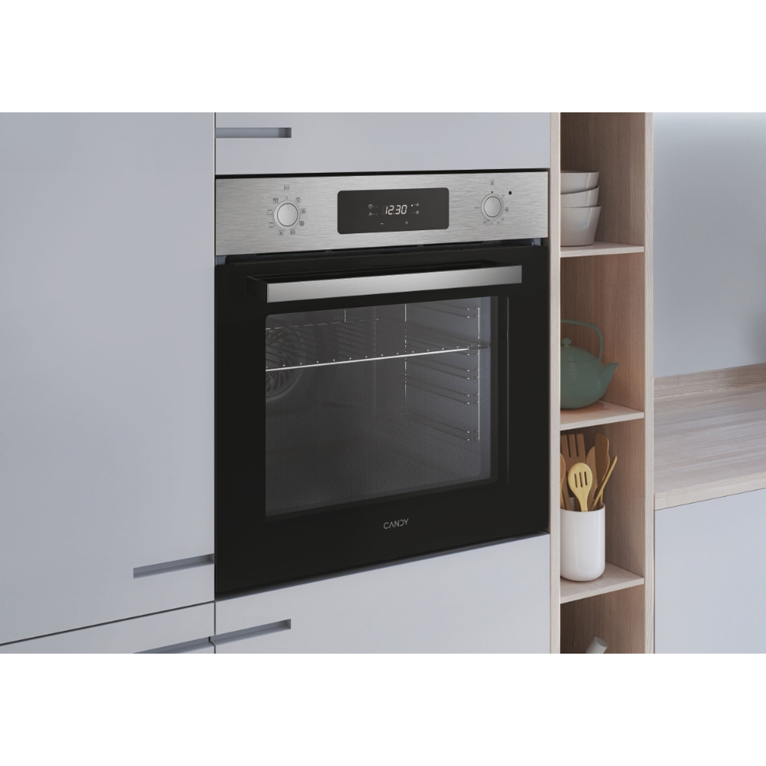 Un forno da incasso moderno con porta nera e display in acciaio inox.