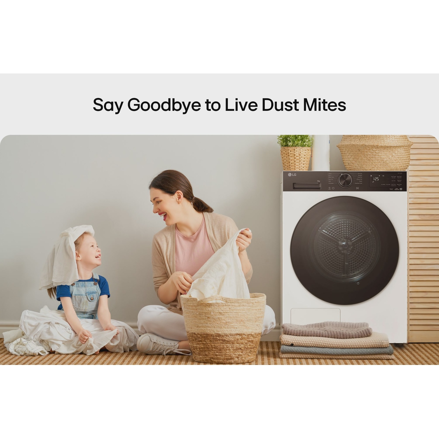 Mother and child with laundry basket in front of a dryer
