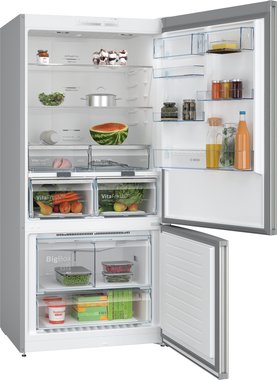 Un refrigerador abierto con alimentos, incluyendo sandía, frutas, verduras y bebidas.
