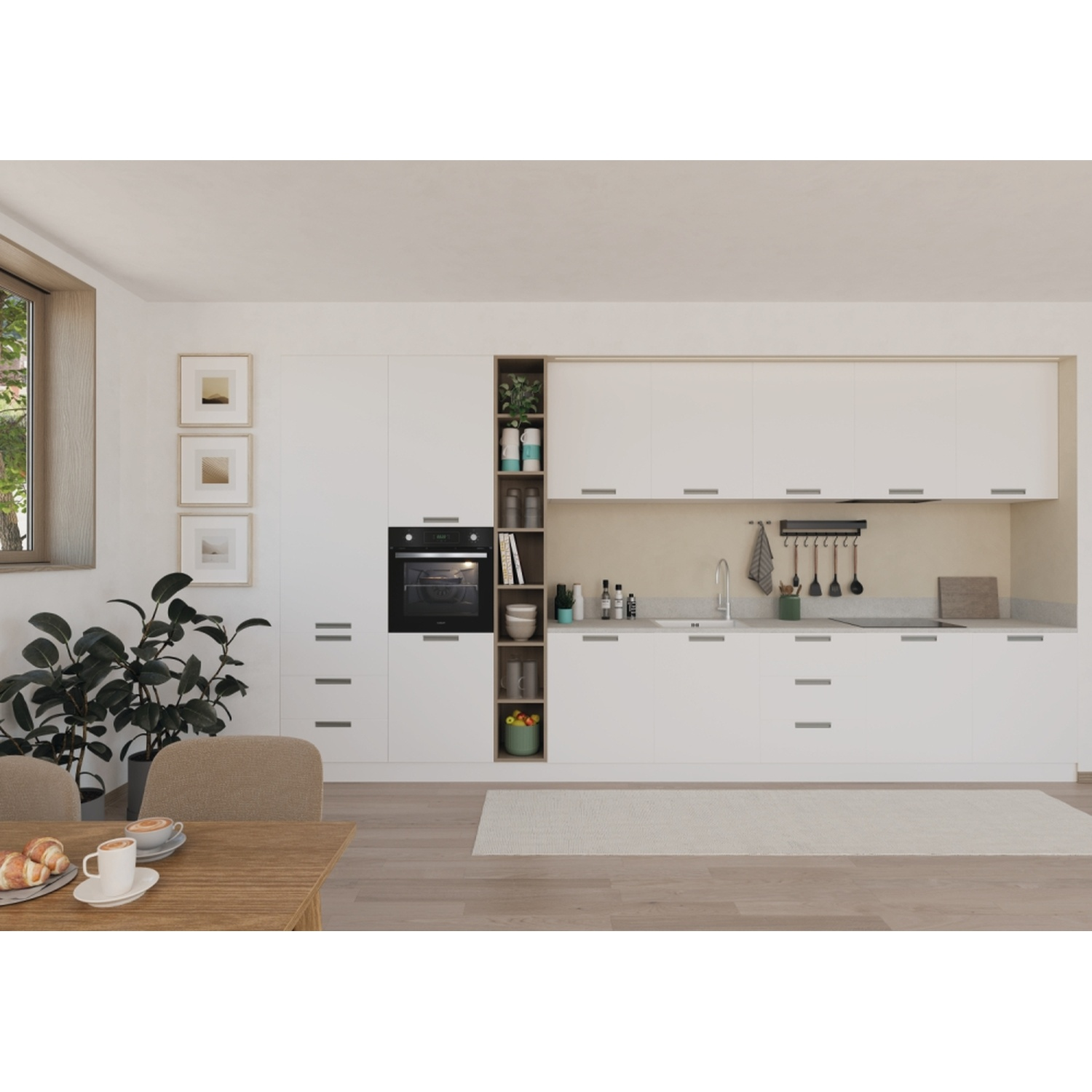 Moderna cucina bianca con tavolo in legno, tazze da caffè e pasticcini davanti.