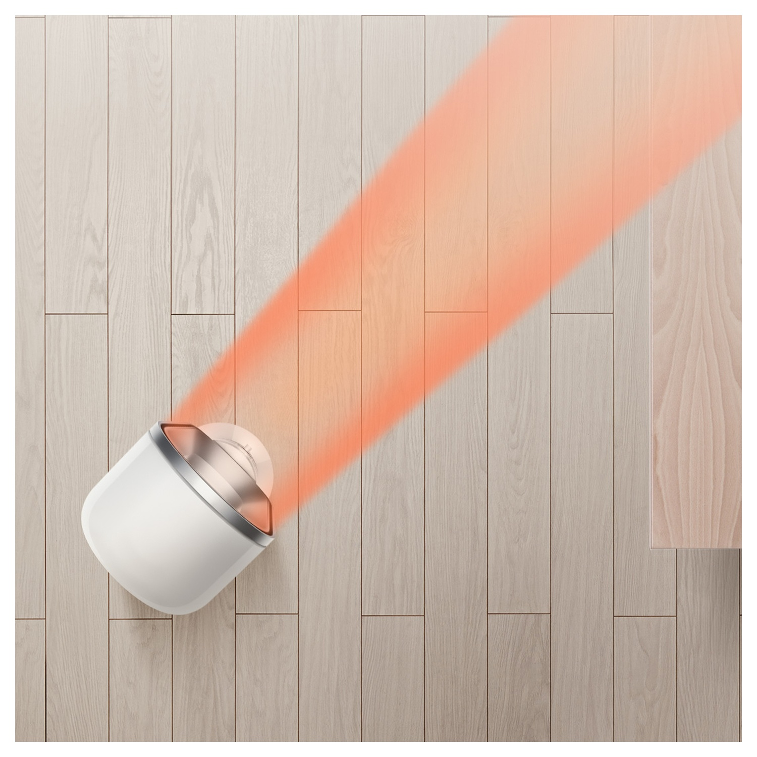 Un dispositivo bianco emette un raggio di luce rossa su un pavimento in legno.