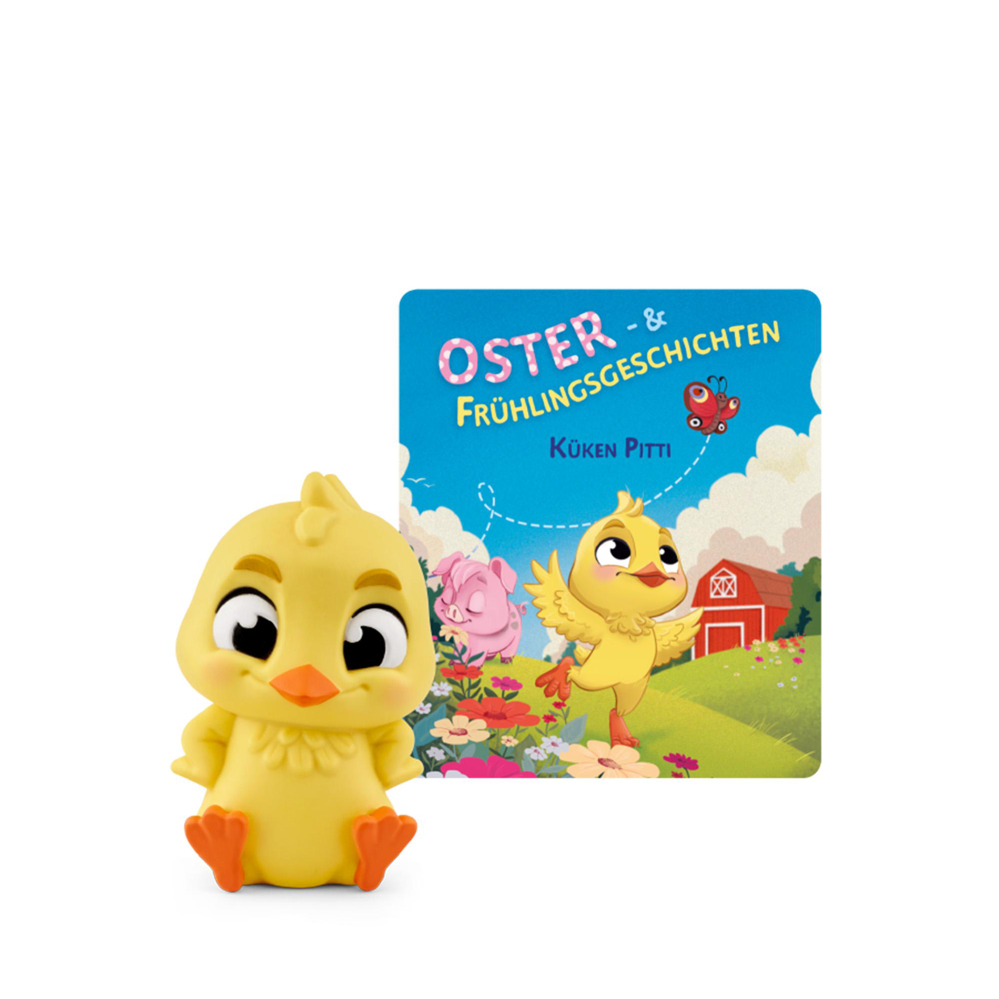 Eine gelbe Kükenfigur neben einem Buch über Ostern und Frühlingsgeschichten.