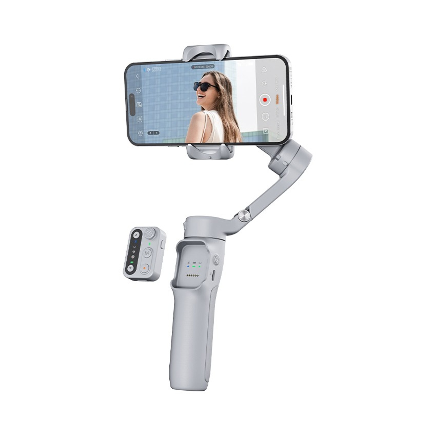 Un gimbal grigio con uno smartphone che mostra una donna. Un piccolo controller è accanto.