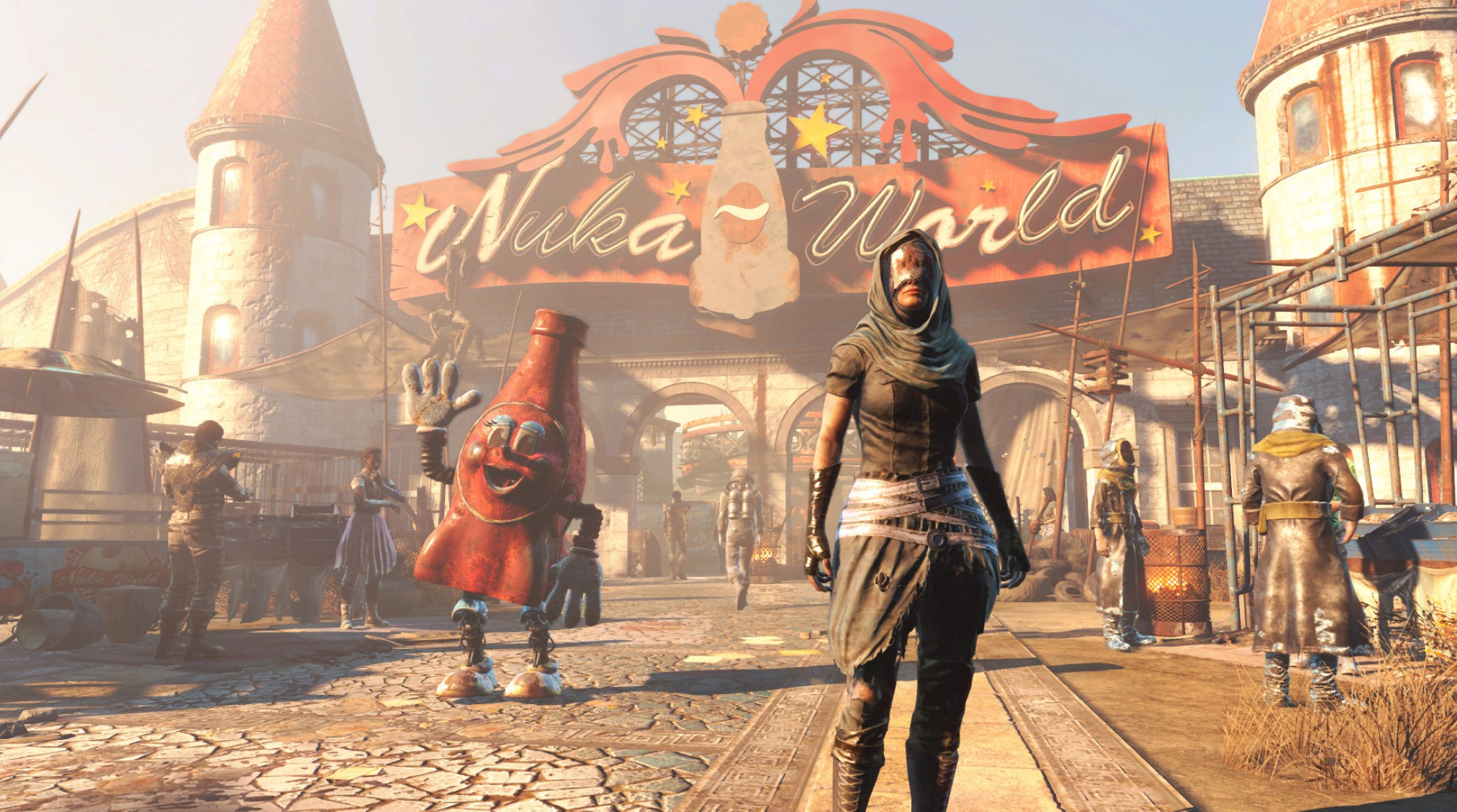 Eine Frau in dunkler Kleidung steht vor dem Nuka-World-Schild. Ein Flaschen-Maskottchen winkt.