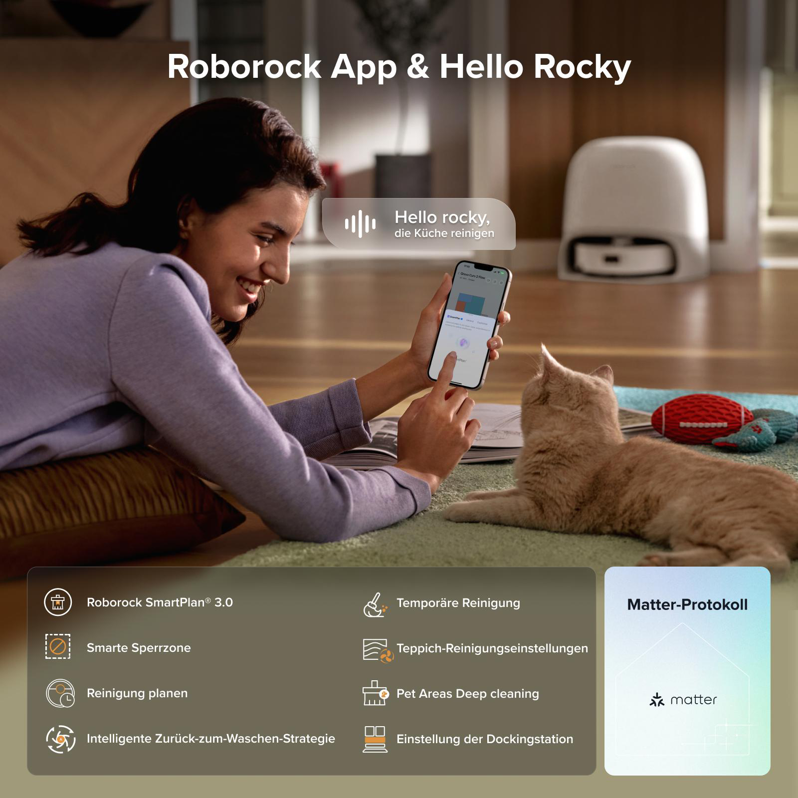 Frau nutzt App mit Roboterstaubsauger, Katze liegt daneben.
