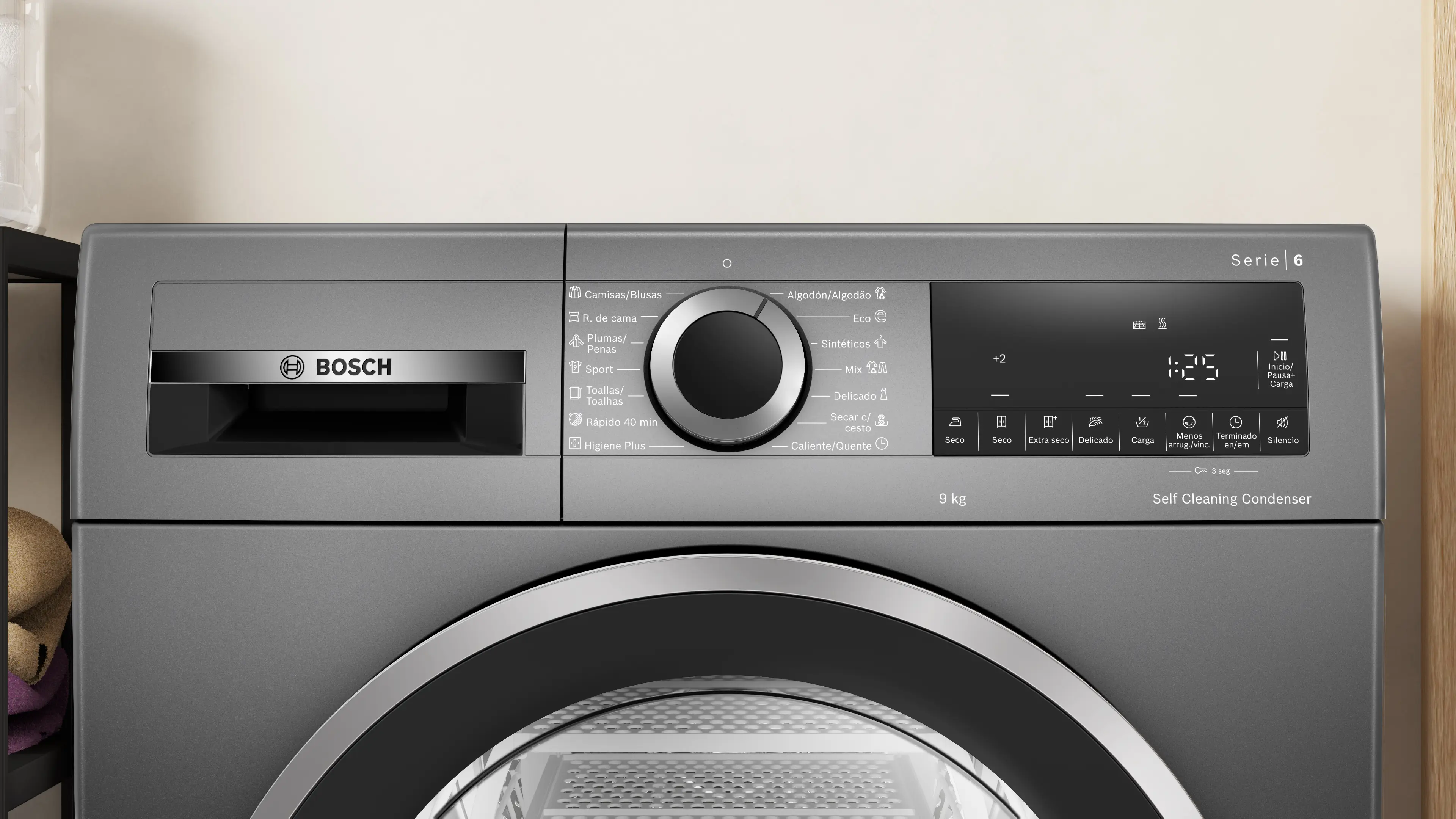 Secadora Bosch gris con panel de control, pantalla y puerta. Etiquetada: Serie 6.