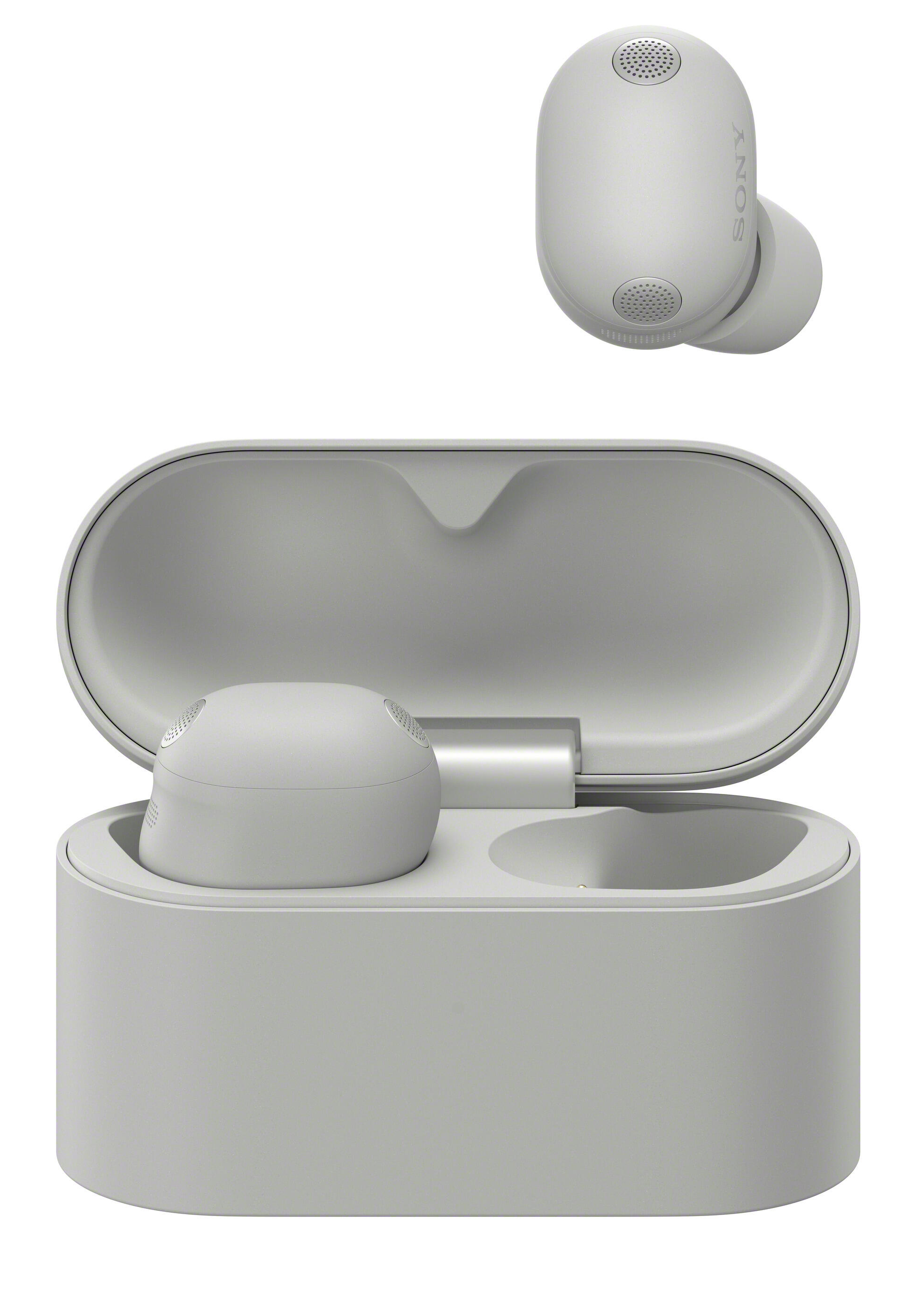Jasnoszare słuchawki Sony z etui ładującym, otwarte.