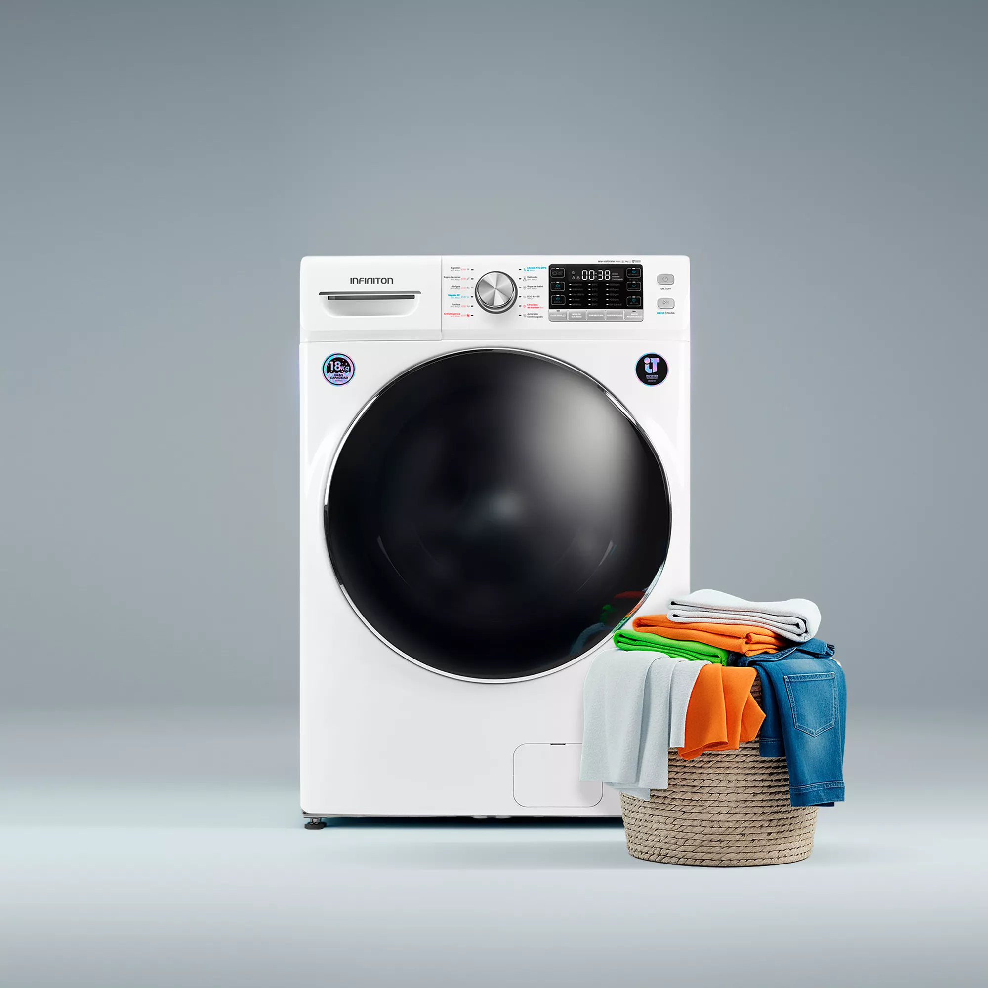 Una lavadora blanca con una cesta de ropa llena al lado.