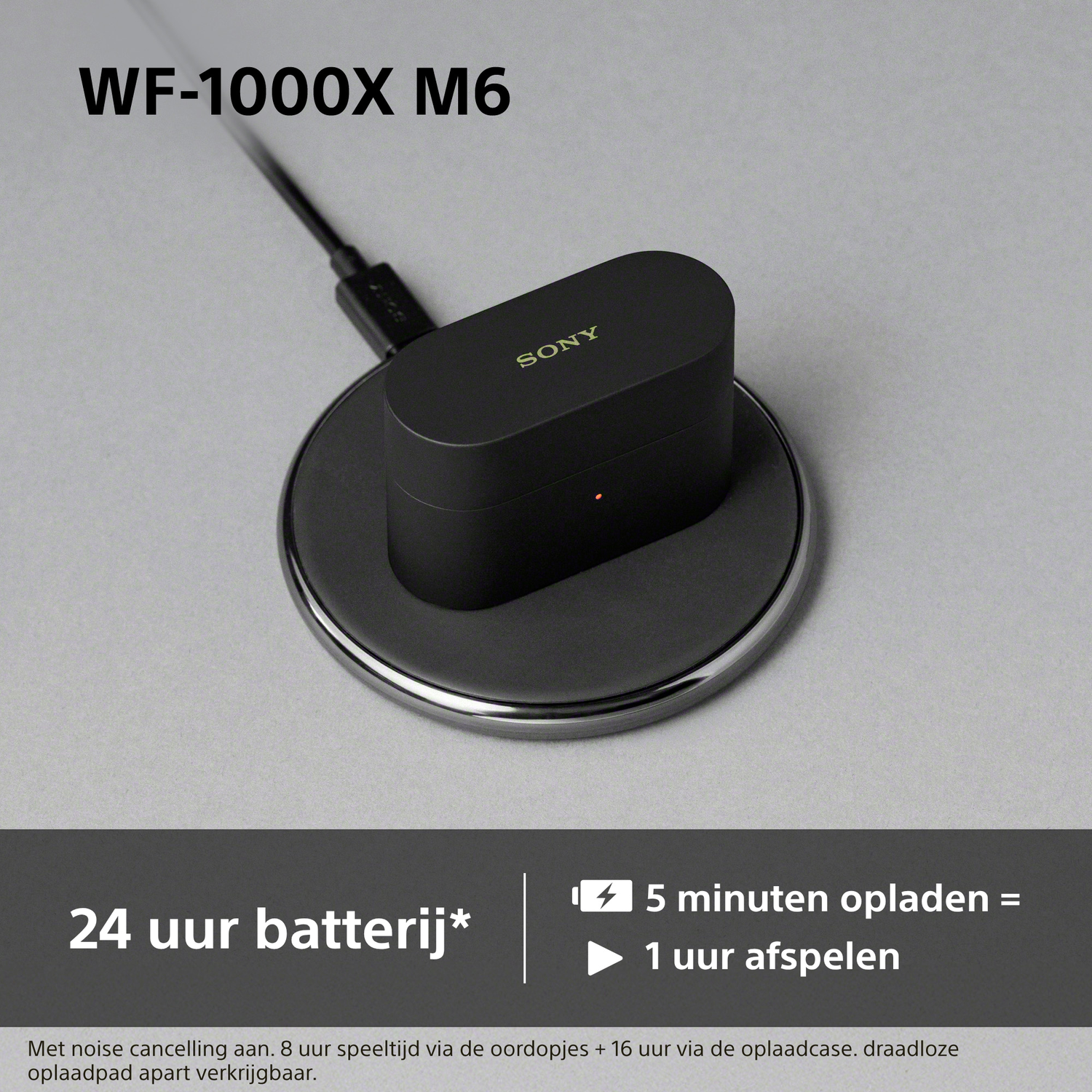 Black Sony WF-1000XM6 charging case on charging pad. 24h battery.