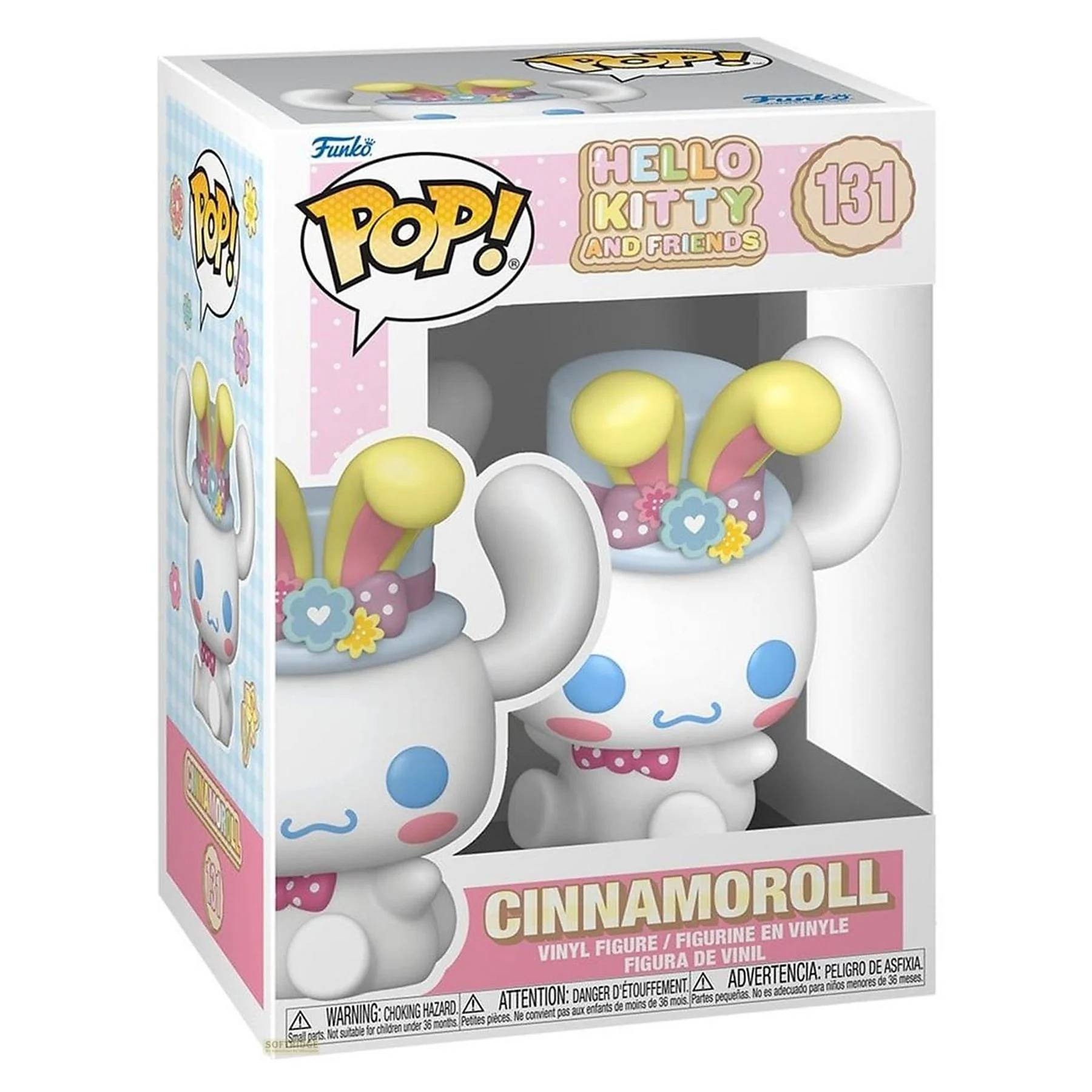 Dos figuras blancas de Cinnamoroll con orejas amarillas y ojos azules en caja.