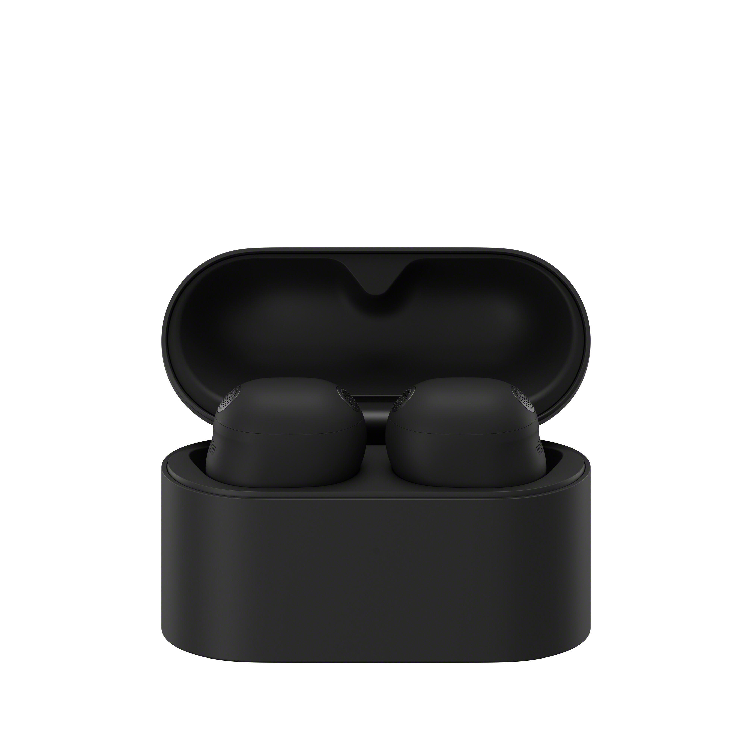 Auriculares inalámbricos negros en un estuche de carga abierto.