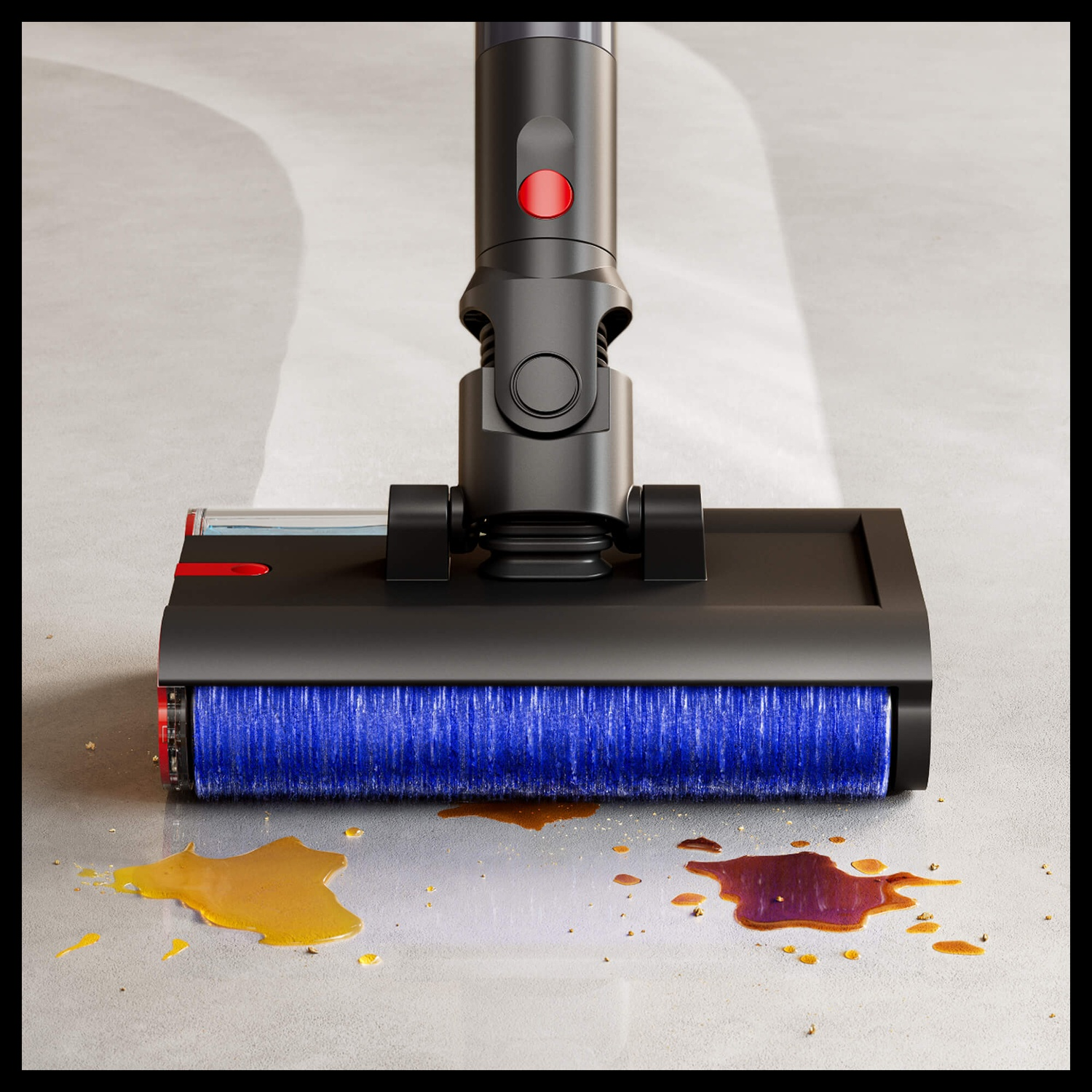 Una testina aspirapolvere con spazzola blu pulisce versamenti su pavimento grigio.