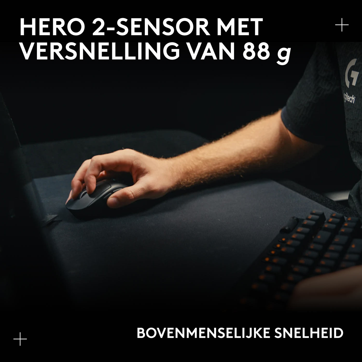 Hand operating a black mouse on a mousepad, keyboard in background.