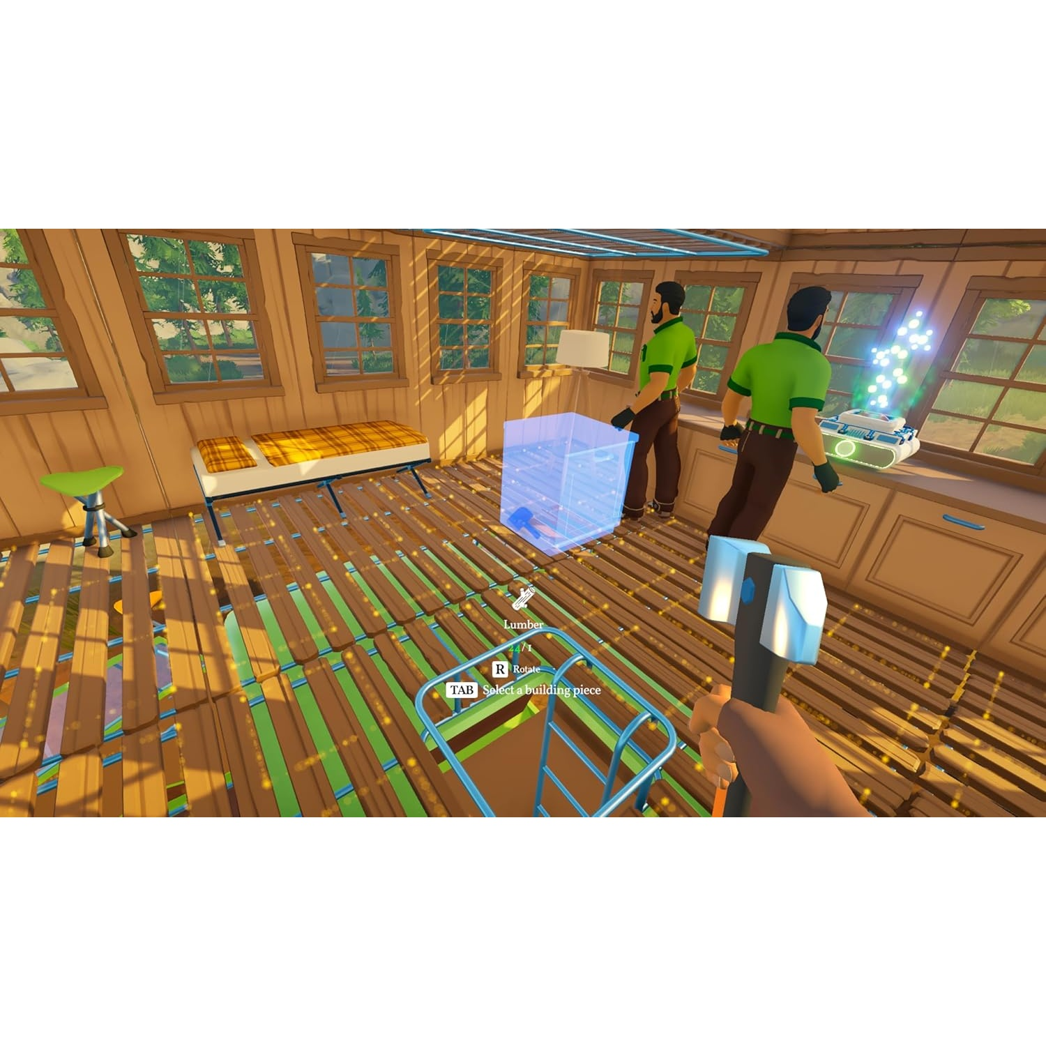 Two men in green shirts build a house. One man holds a hammer.