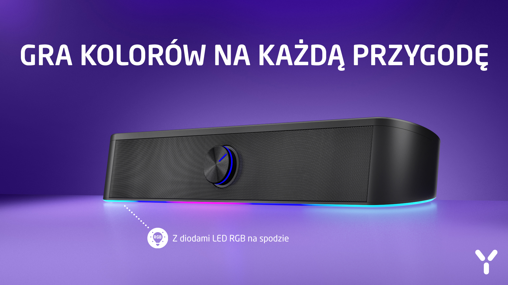 Czarny głośnik z oświetleniem RGB na spodzie, niebieski akcent na pokrętle.