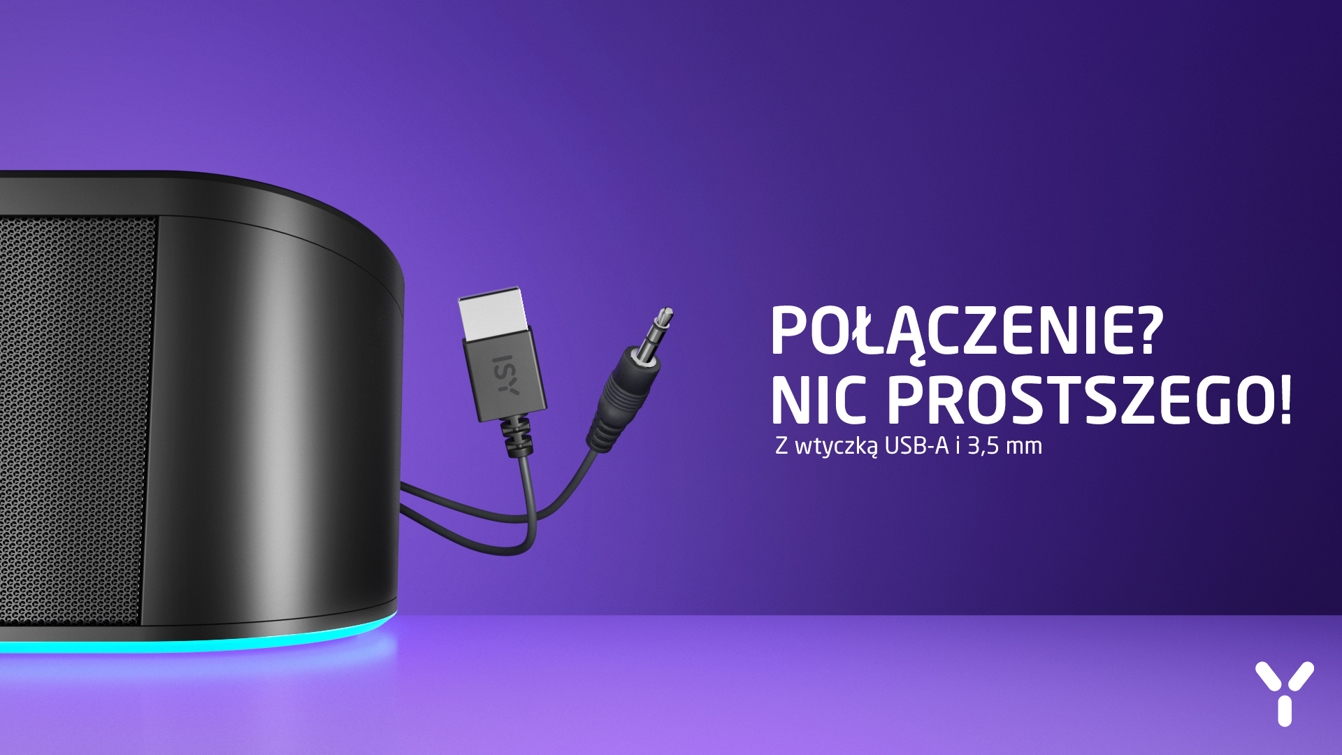 Czarny głośnik z wtyczką ISY USB-A i jack 3,5 mm na fioletowym tle.