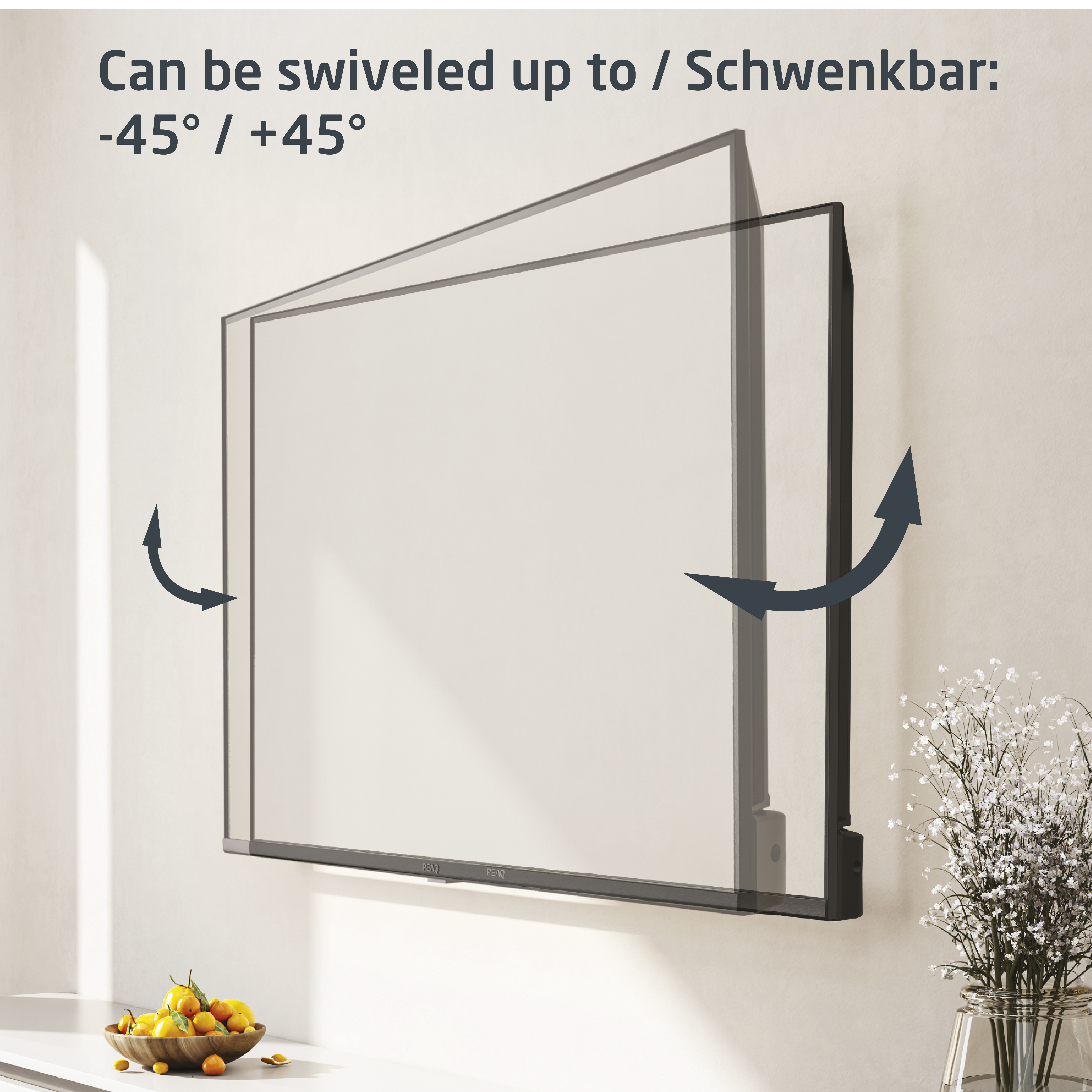 Obrotowy telewizor na uchwycie ściennym z miską owoców i kwiatami.