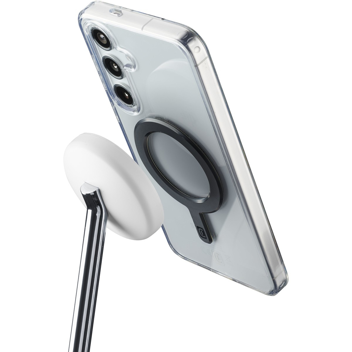 Un teléfono transparente con anillo MagSafe sujeto a un soporte redondo blanco.
