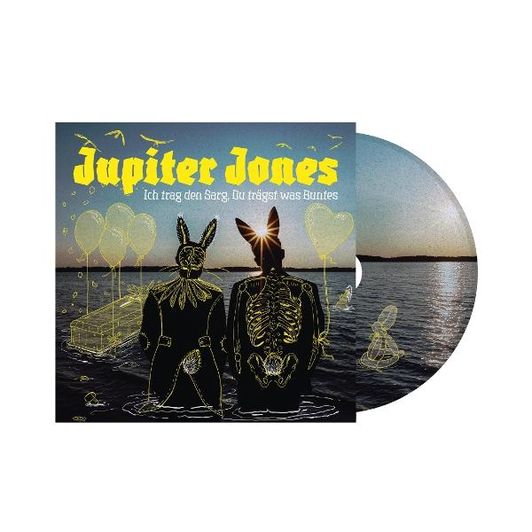 Jupiter Jones CD: Zwei Figuren in Hasenmasken, Sarg, Luftballons, See