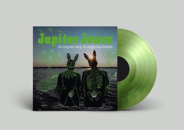 Plattencover mit zwei Figuren in Hasenkostümen im Wasser, daneben eine grüne Vinylplatte.