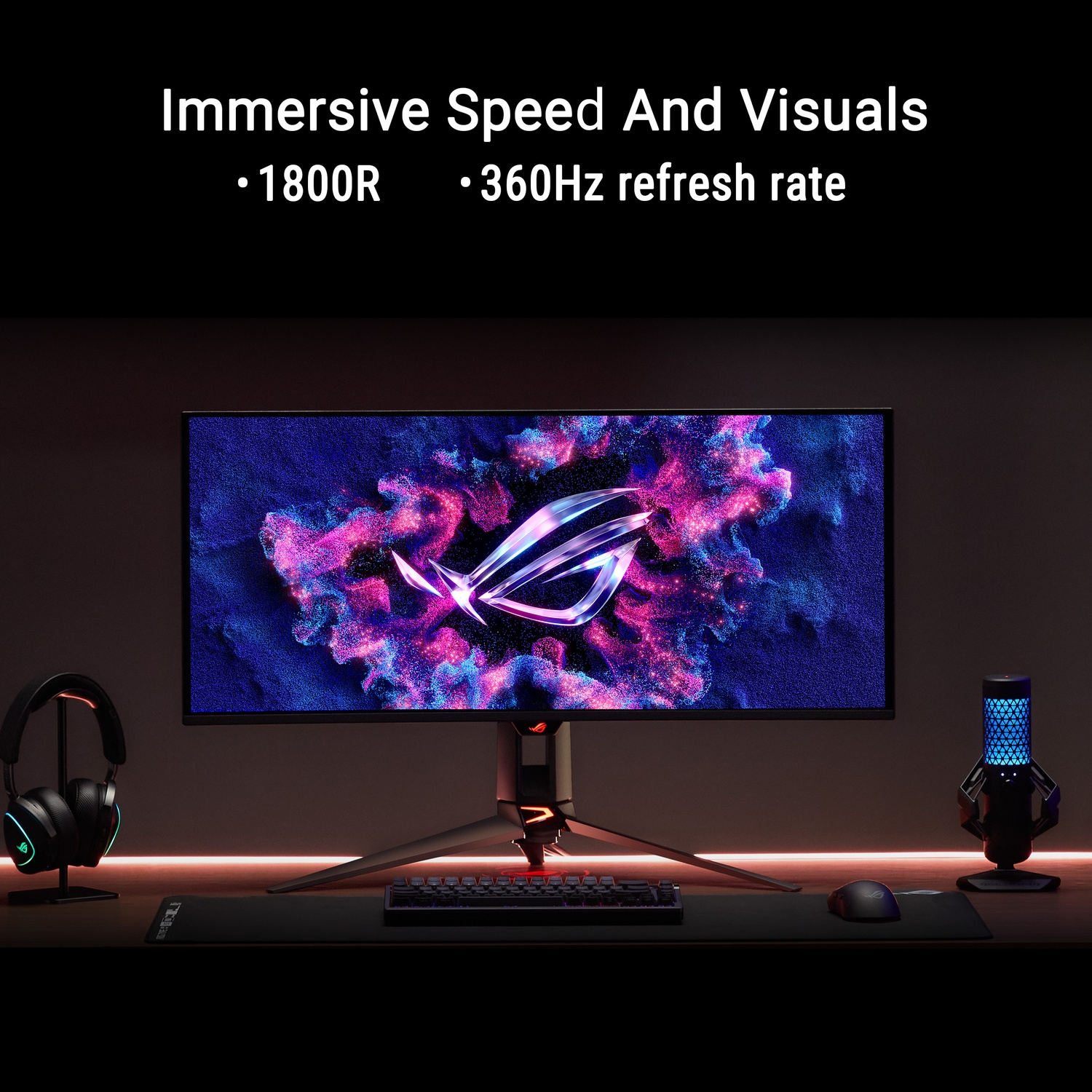 A gaming setup featuring a monitor, headphones, microphone, and mouse on a desk.