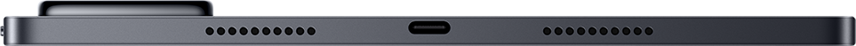 Sötétszürke tablet alsó élének közeli felvétele, középen USB-C porttal és két hangszórórácstal.
