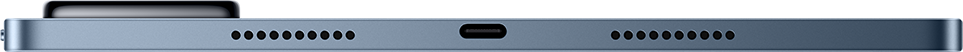 Közeli felvétel egy kék elektronikus eszköz alsó éléről, két hangszóróráccsal, amelyek egy központi USB-C portot fognak közre.