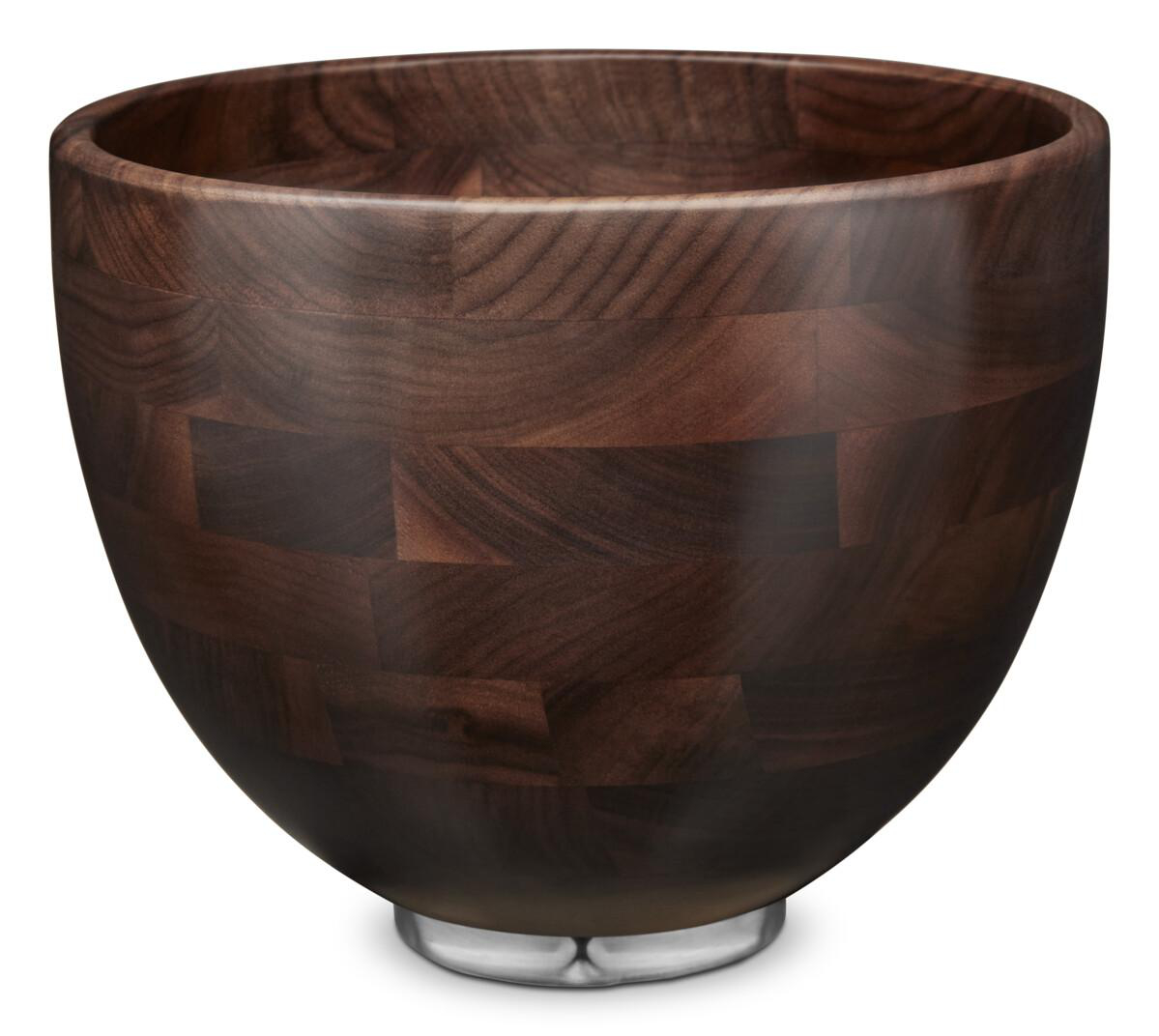 Eine dunkle Holzschale mit einem Metallfuß. Die Schale ist aus rechteckigen Holzstücken gefertigt.