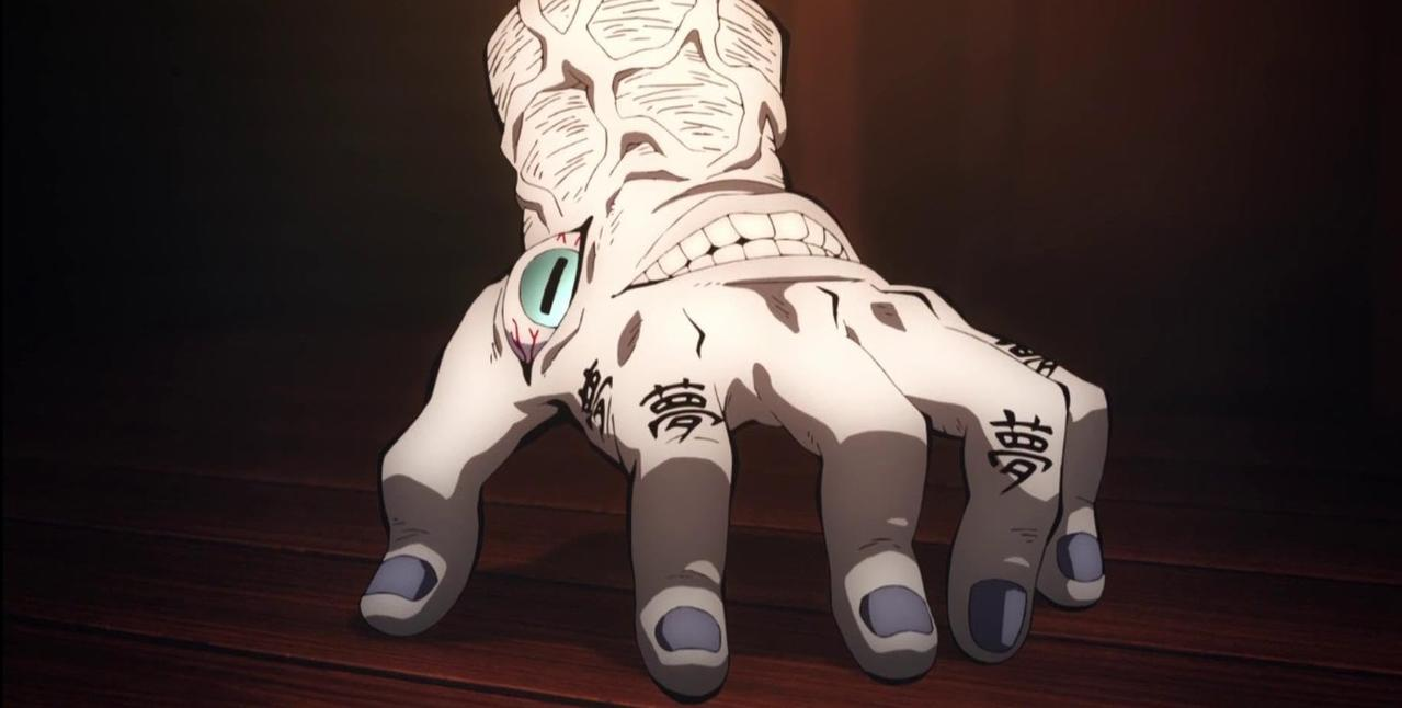 Eine weiße Hand mit einem Auge und einem Mund, japanischen Schriftzeichen auf den Fingern.