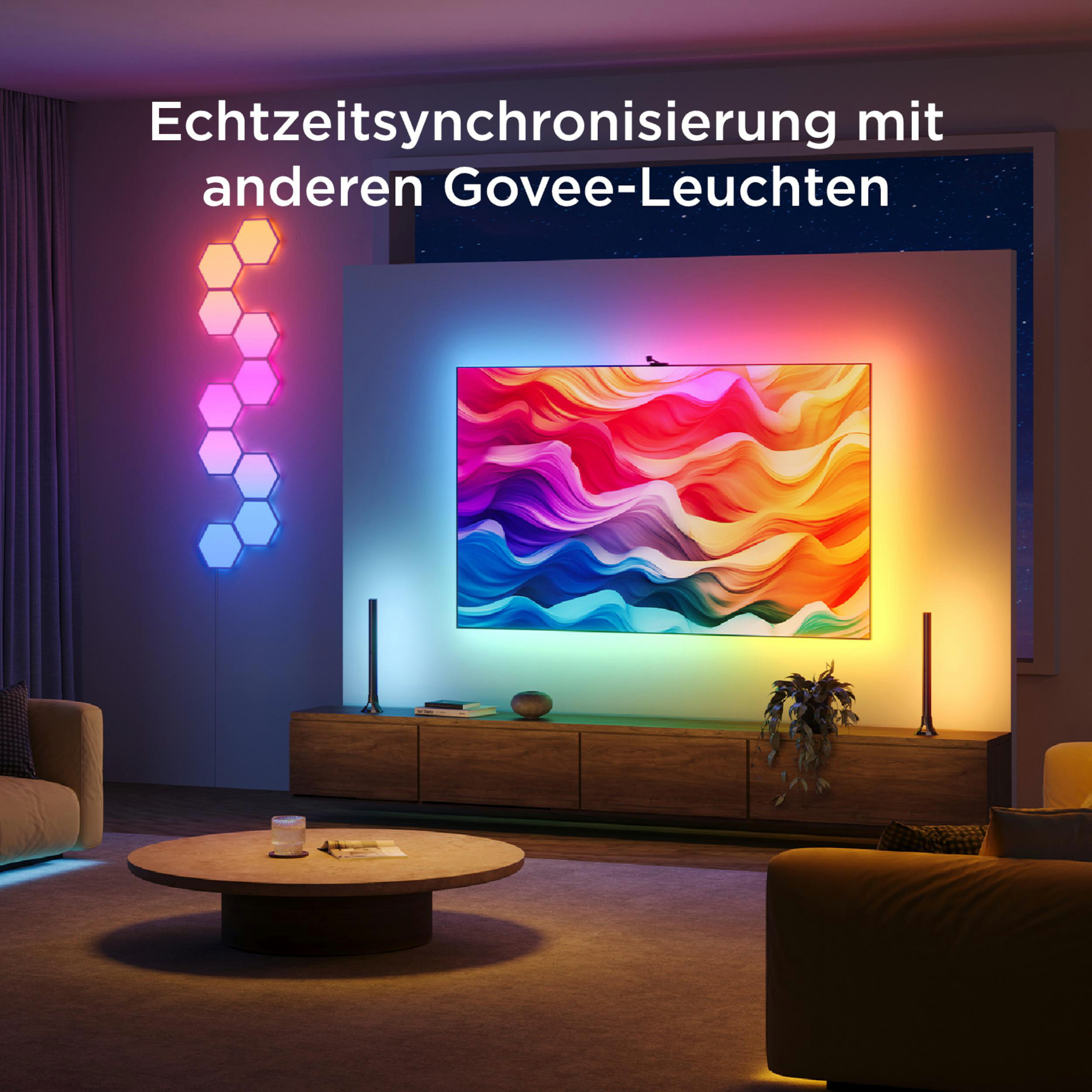 Wohnzimmer mit farbigen Govee-Leuchten an Wand und TV.