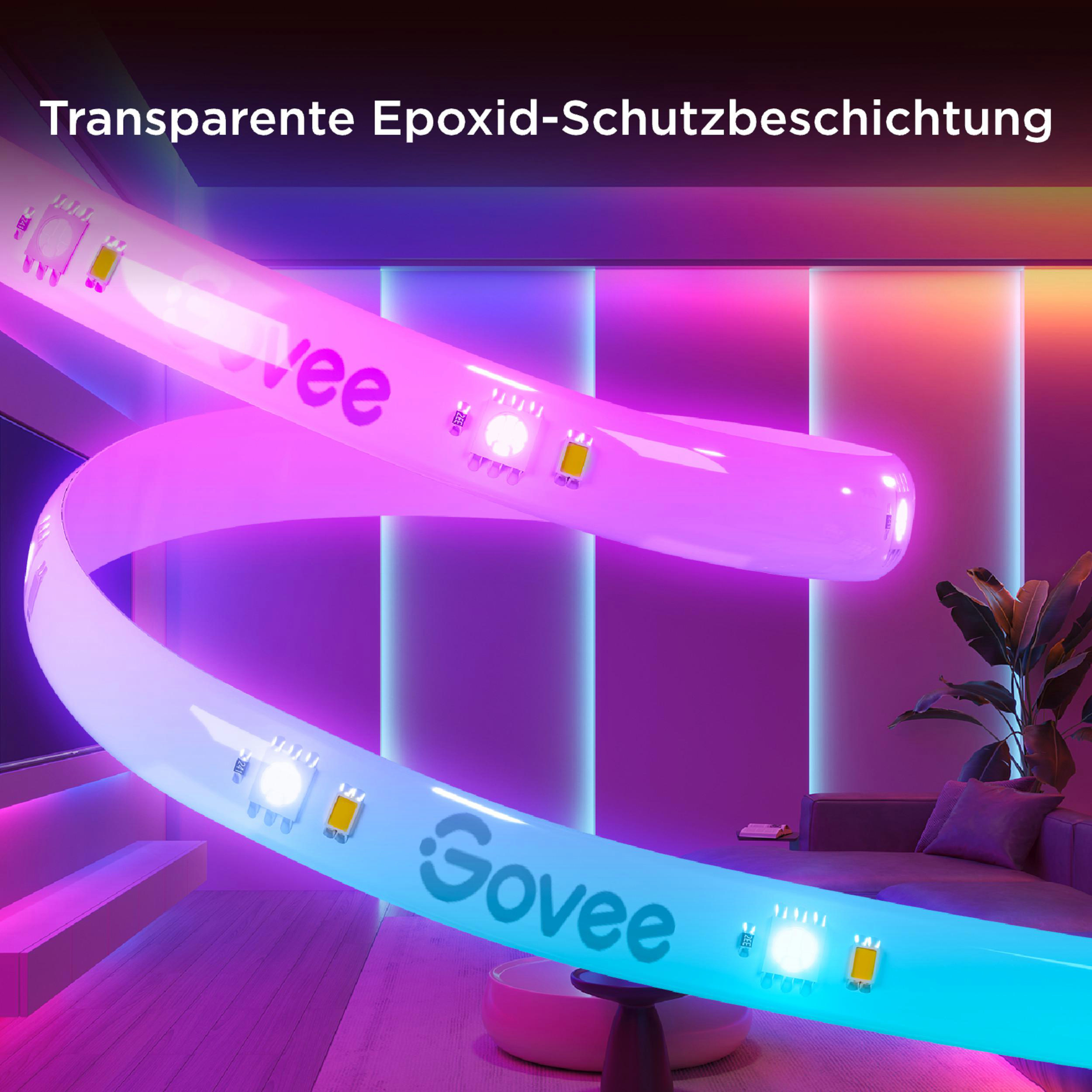 Eine biegsame LED-Leiste mit Govee-Logo leuchtet in Blau und Pink in einem modernen Raum.