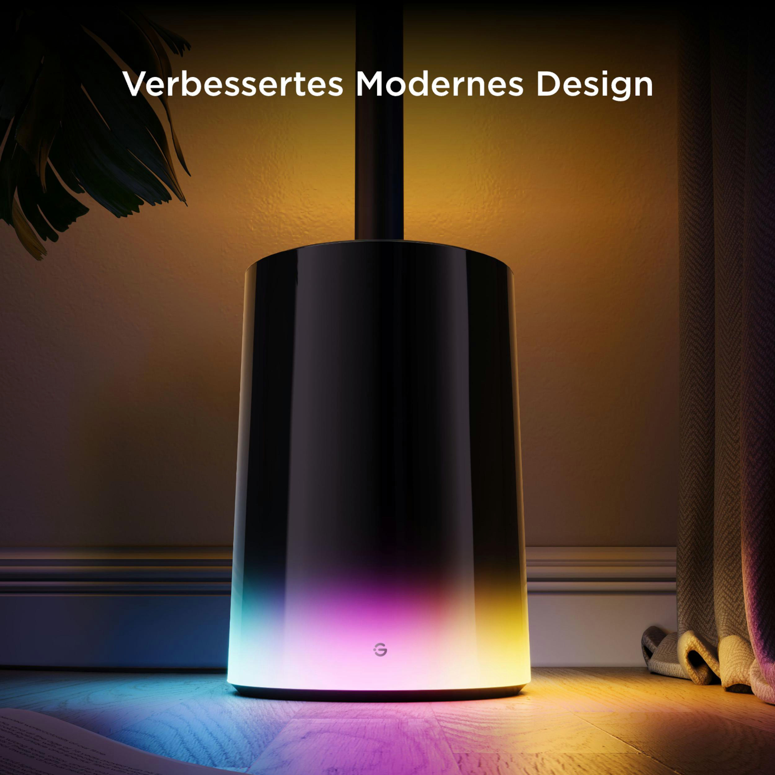 Ein schwarzer Zylinder leuchtet in bunten Farben auf einem Holzboden.