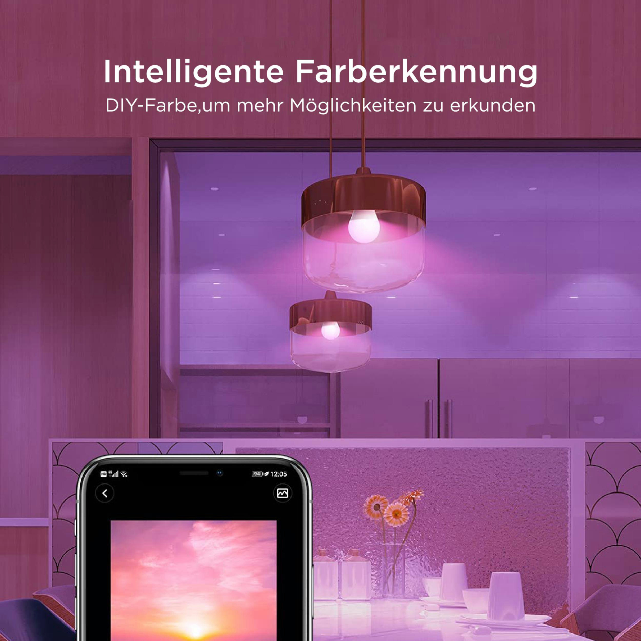 Zwei Lampen mit pinkem Licht über einem Tisch mit Blumen und Gläsern.
