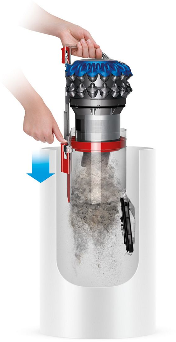 Une main tient une tête d'aspirateur bleue pendant que la poussière est aspirée dans un conteneur.