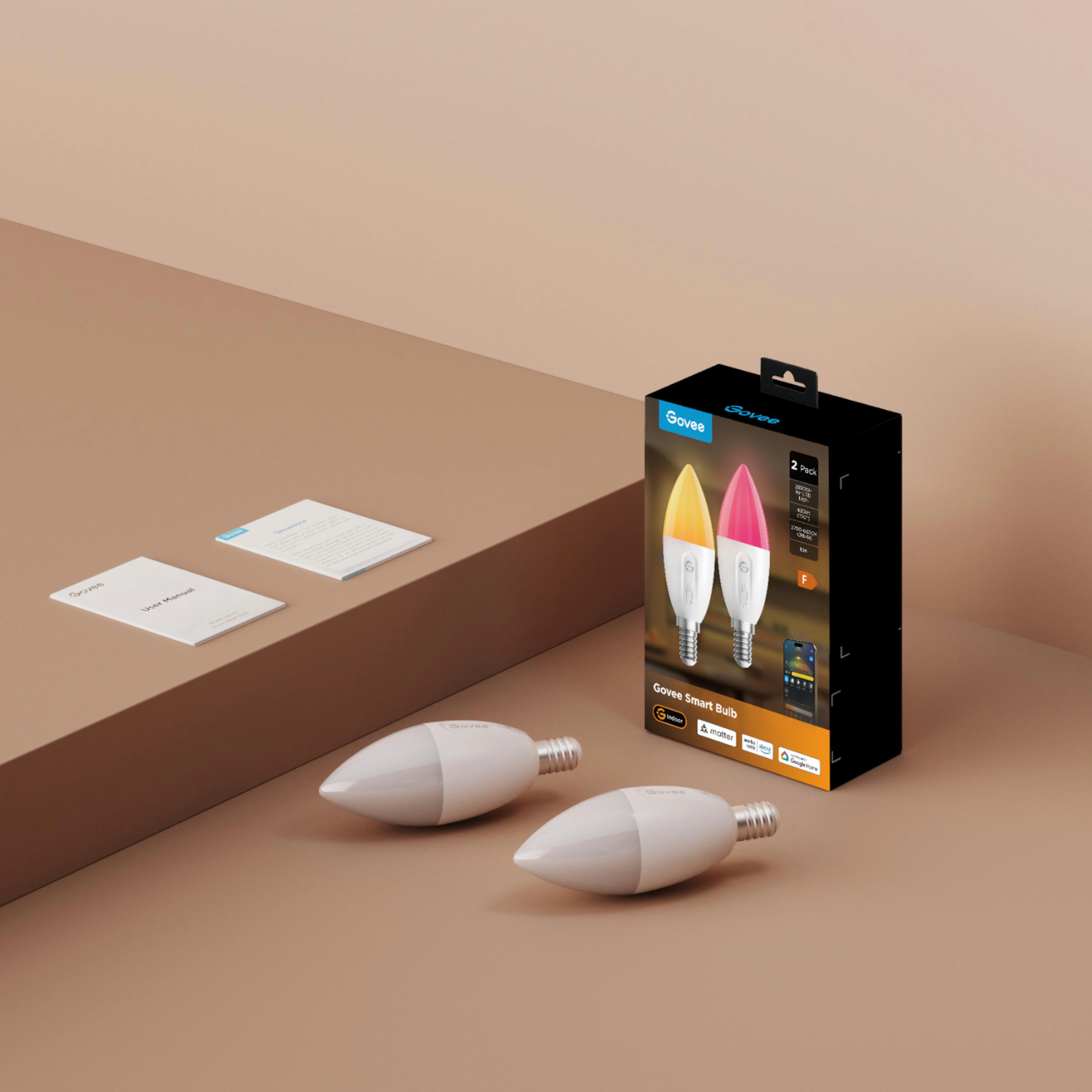 Govee Smart Bulb Verpackung mit zwei Glühbirnen und Bedienungsanleitungen auf einem Tisch.