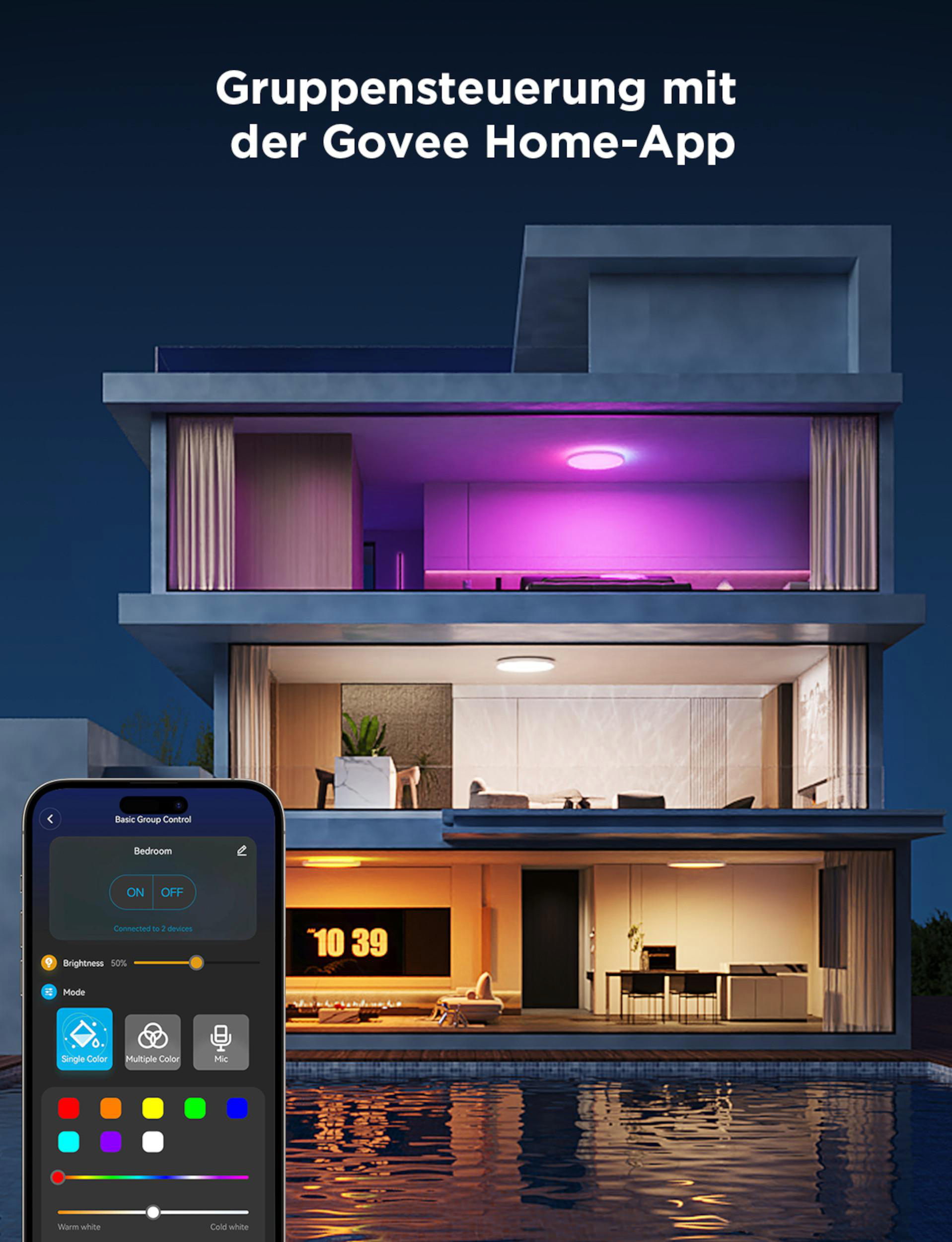 Moderne Villa mit Schwimmbad und App-Steuerung für Beleuchtung. Farbige Lichter leuchten.