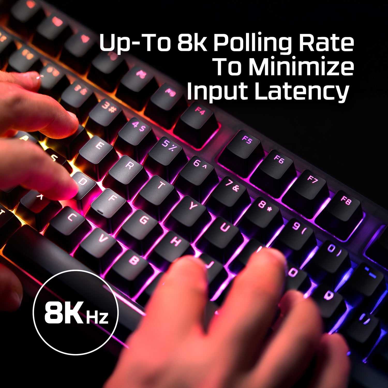 Hands typing on a keyboard with RGB lighting. 8KHz.