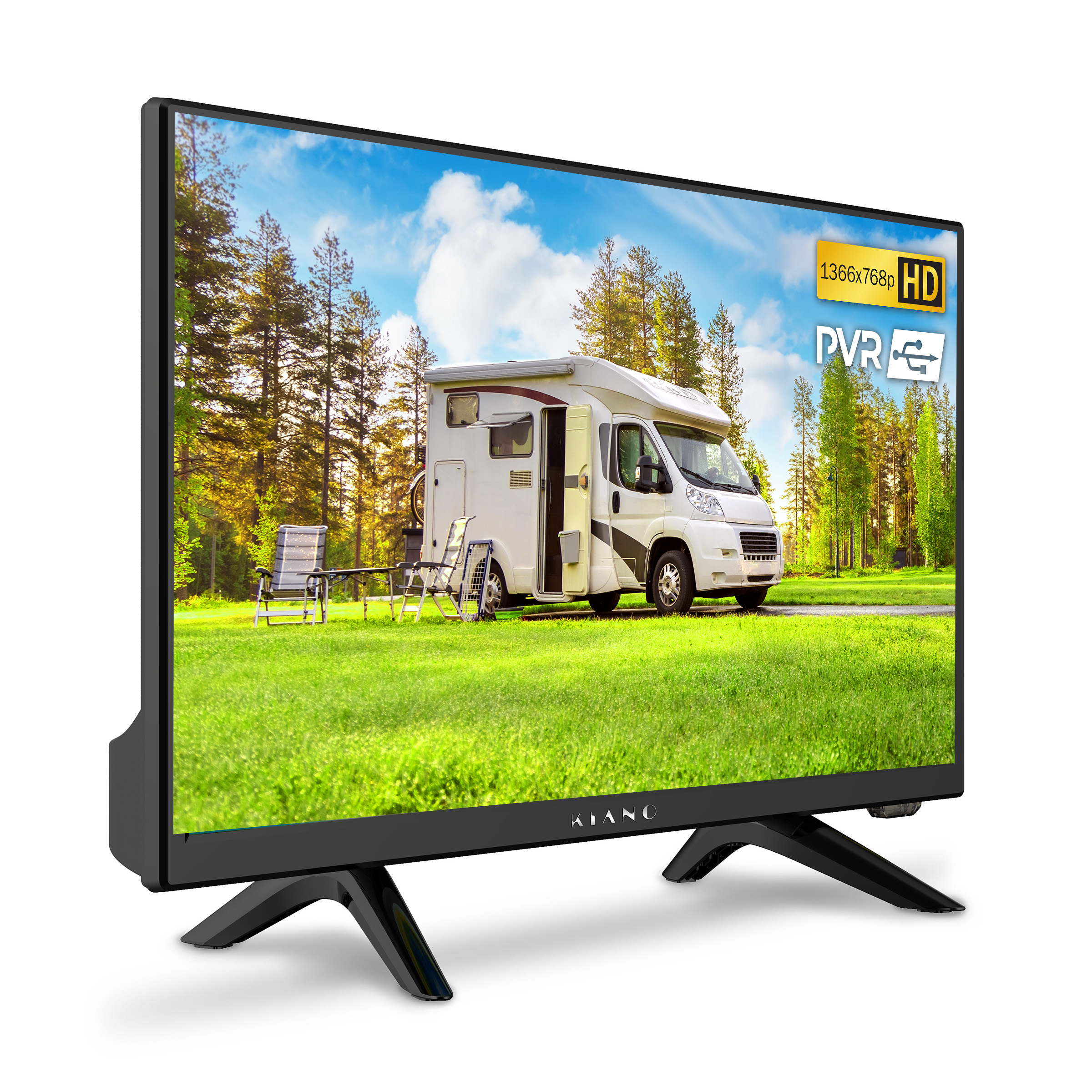 Kamper zaparkowany na trawiastym polu z drzewami w tle.